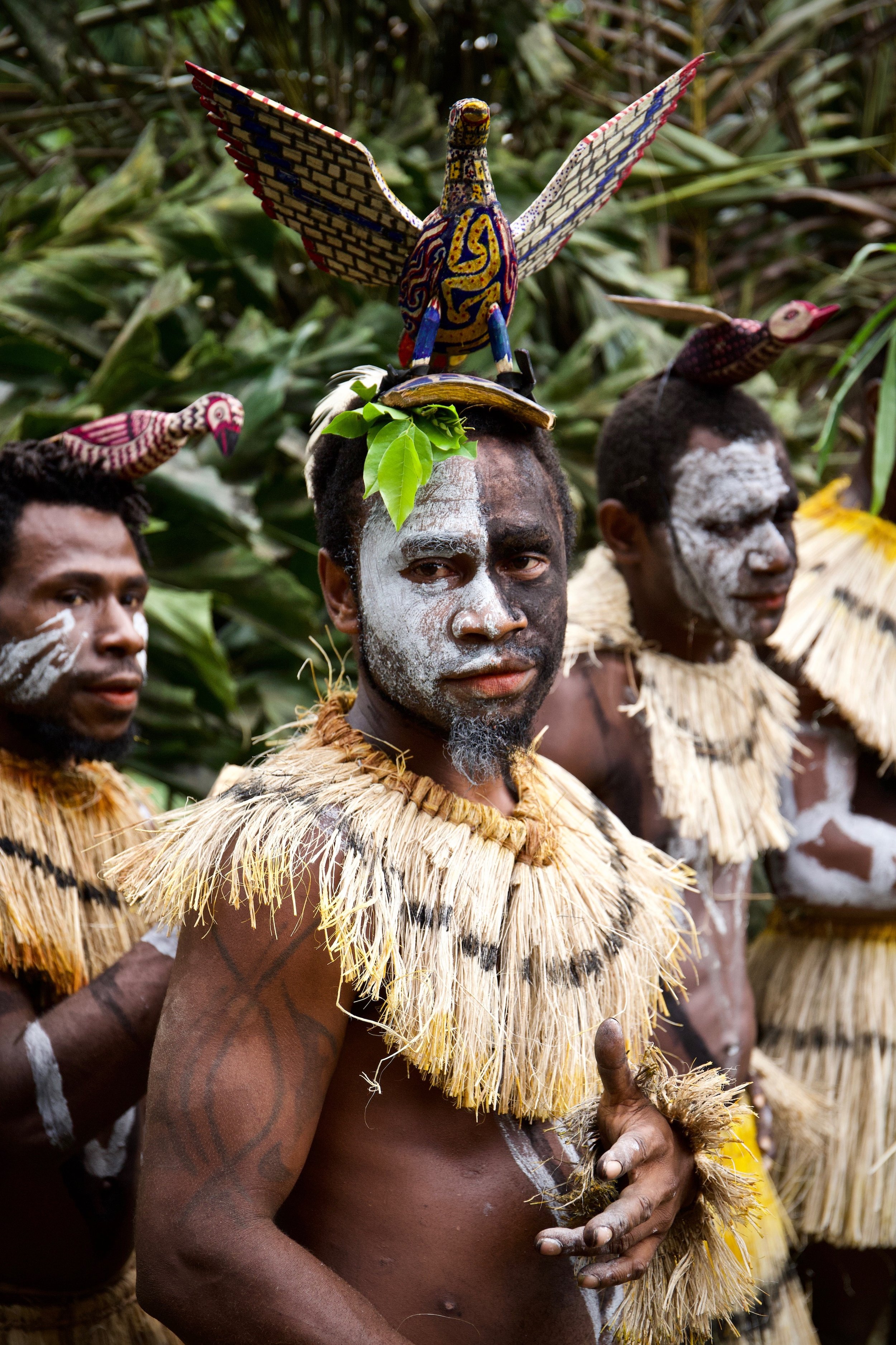 Portraits and candid moments of Papua New Guinea’s diverse cultures, featuring traditional dress, masks, and ceremonial performances.
