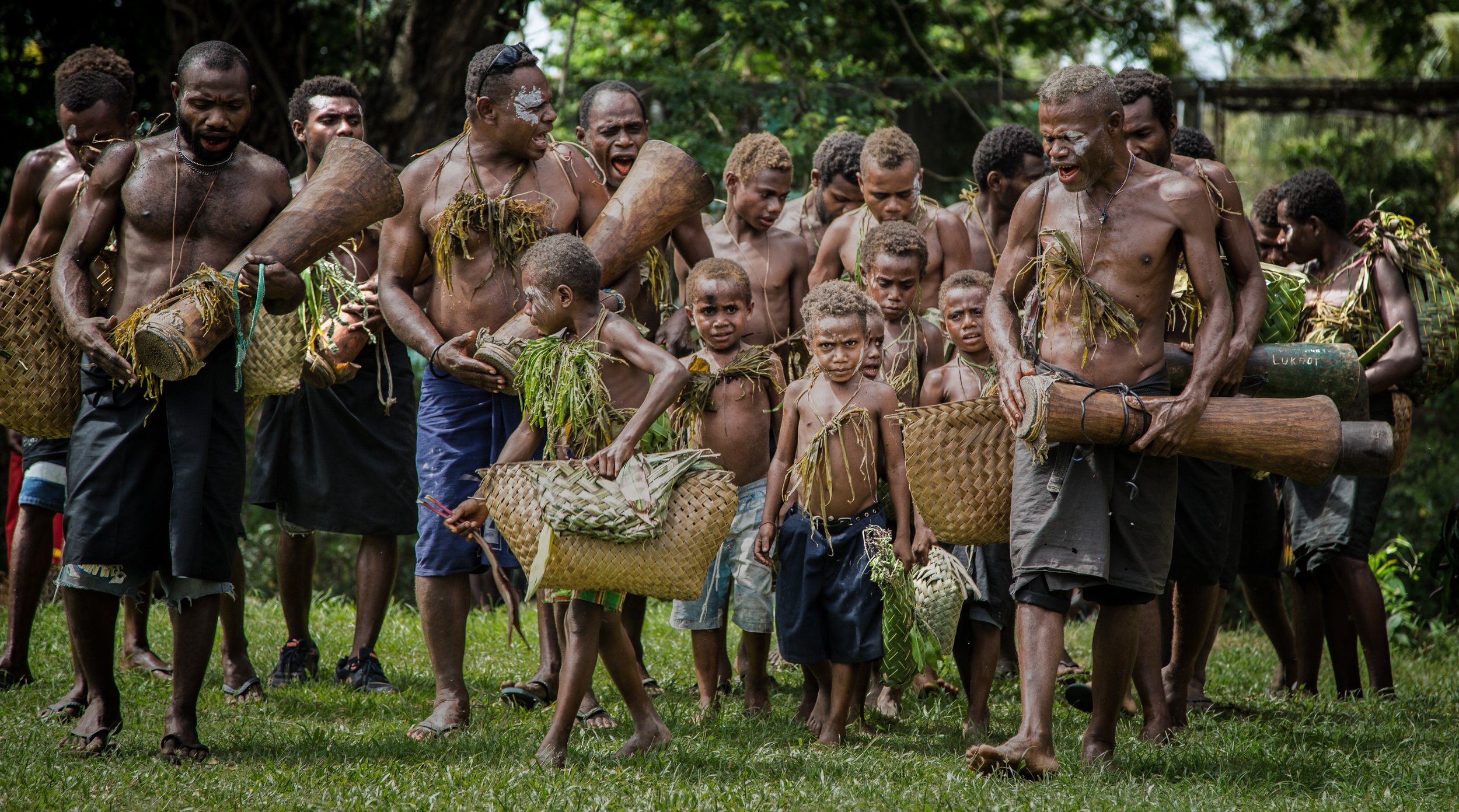 Portraits and candid moments of Papua New Guinea’s diverse cultures, featuring traditional dress, masks, and ceremonial performances.