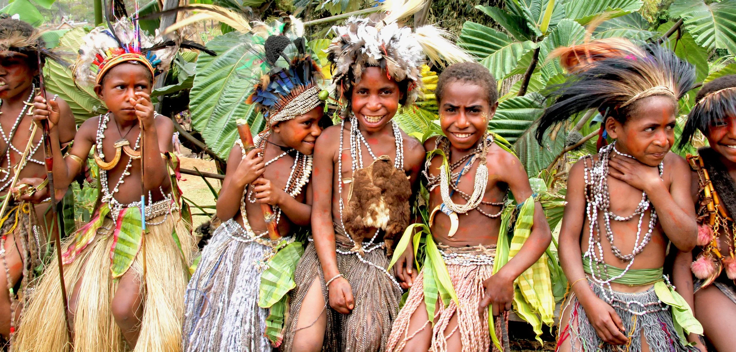 Portraits and candid moments of Papua New Guinea’s diverse cultures, featuring traditional dress, masks, and ceremonial performances.