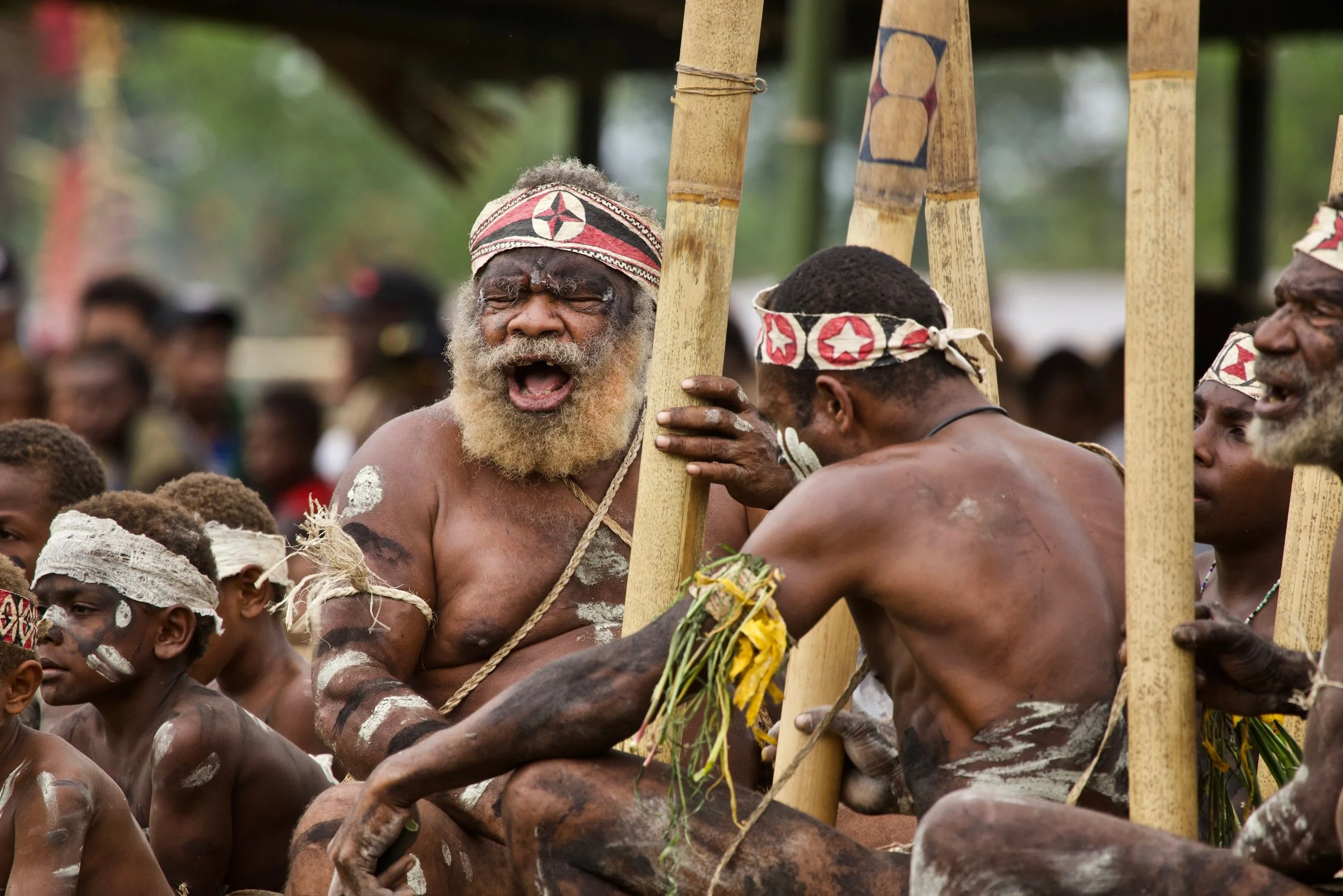 Portraits and candid moments of Papua New Guinea’s diverse cultures, featuring traditional dress, masks, and ceremonial performances.