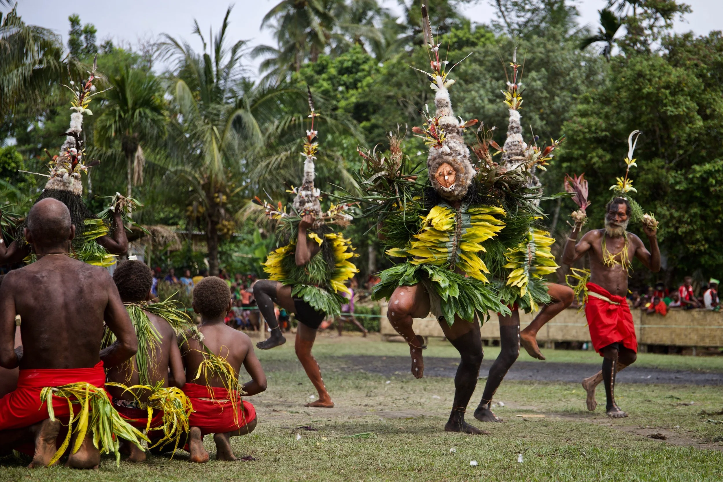 Portraits and candid moments of Papua New Guinea’s diverse cultures, featuring traditional dress, masks, and ceremonial performances.