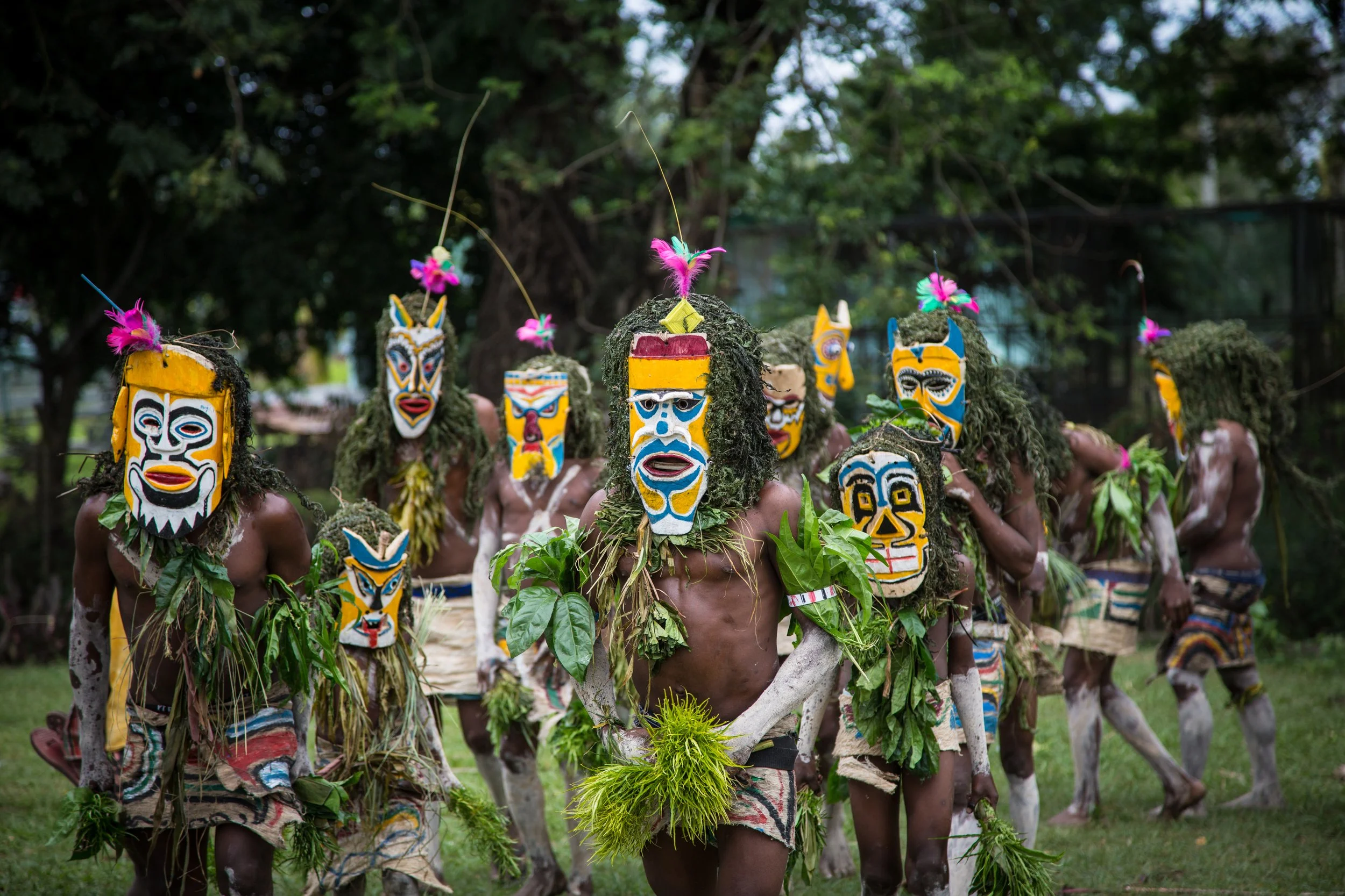 Portraits and candid moments of Papua New Guinea’s diverse cultures, featuring traditional dress, masks, and ceremonial performances.