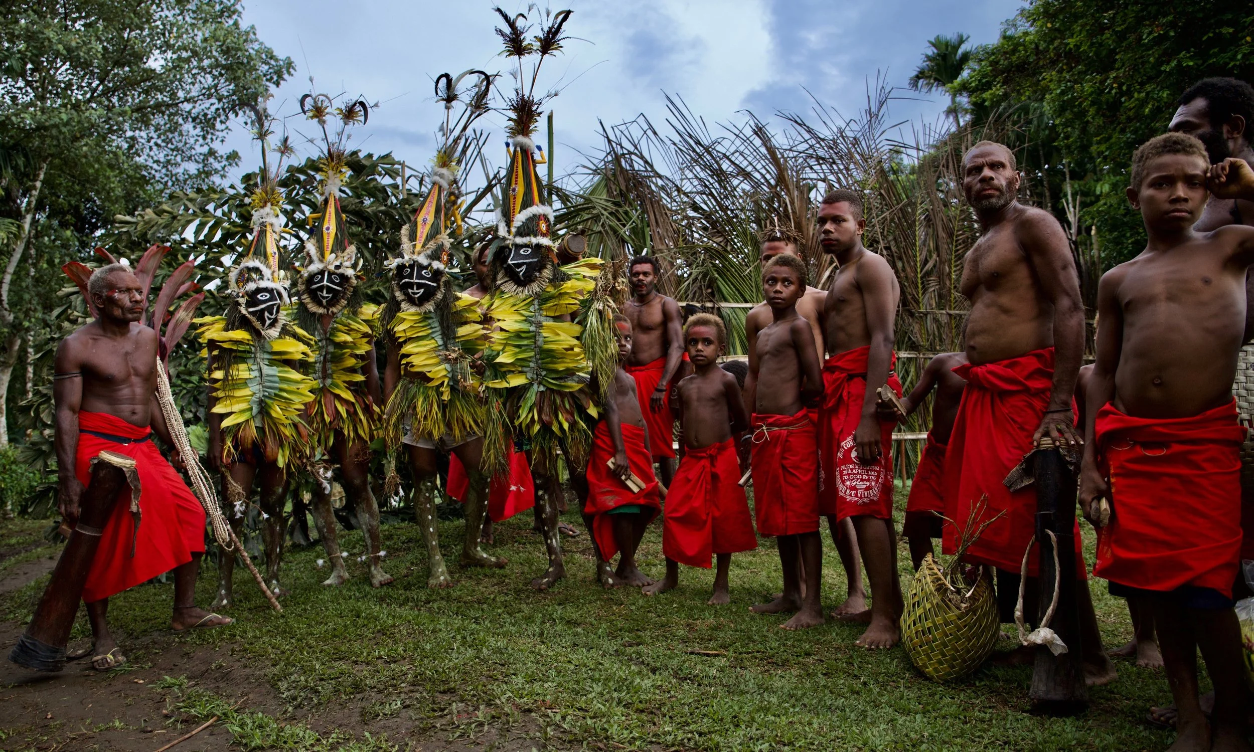 Portraits and candid moments of Papua New Guinea’s diverse cultures, featuring traditional dress, masks, and ceremonial performances.