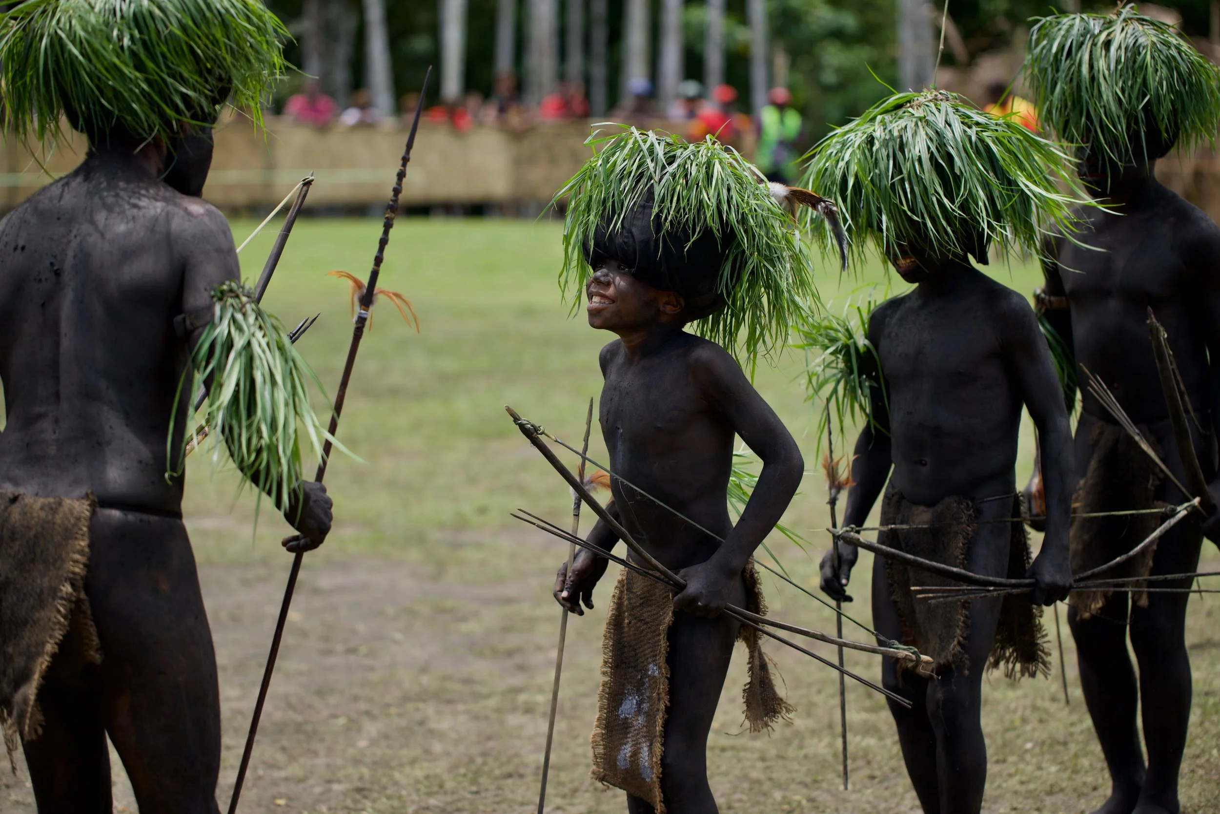 Portraits and candid moments of Papua New Guinea’s diverse cultures, featuring traditional dress, masks, and ceremonial performances.