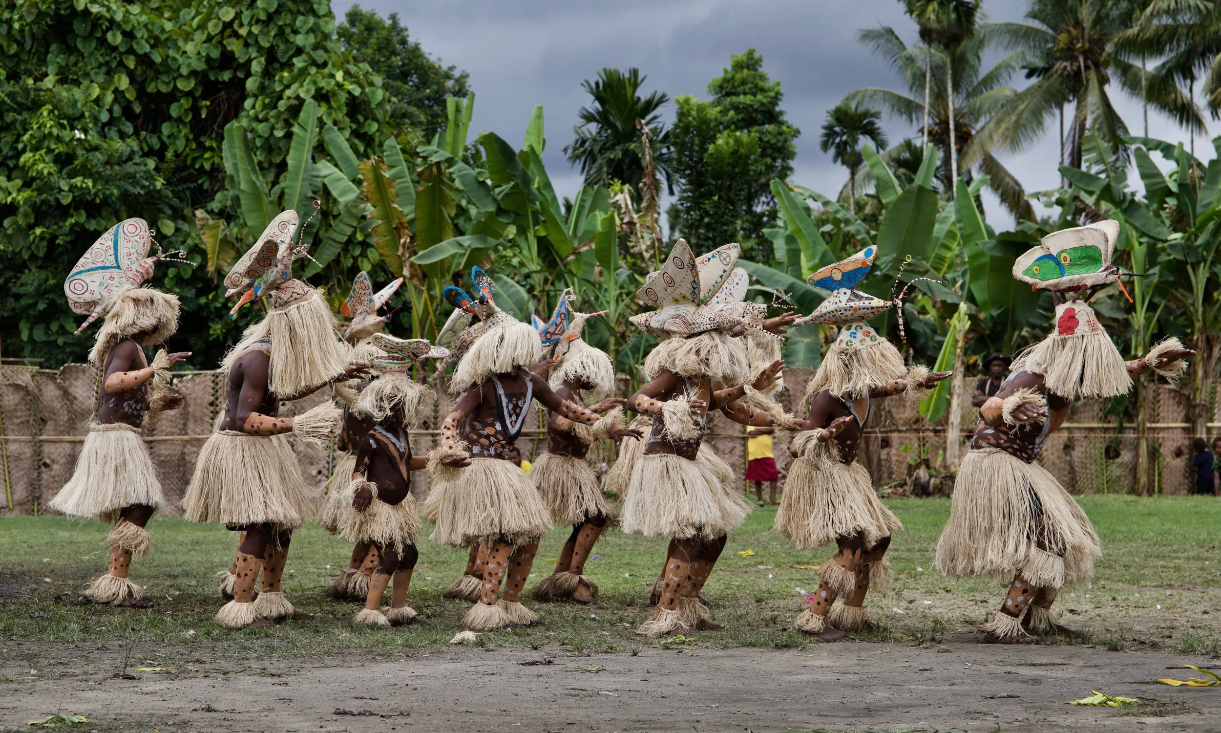 Portraits and candid moments of Papua New Guinea’s diverse cultures, featuring traditional dress, masks, and ceremonial performances.