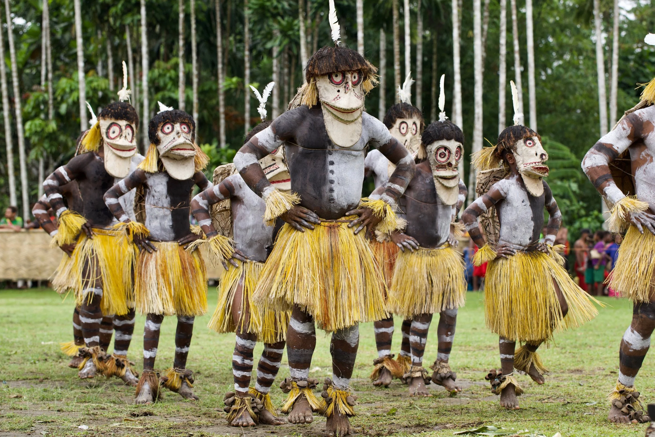Portraits and candid moments of Papua New Guinea’s diverse cultures, featuring traditional dress, masks, and ceremonial performances.