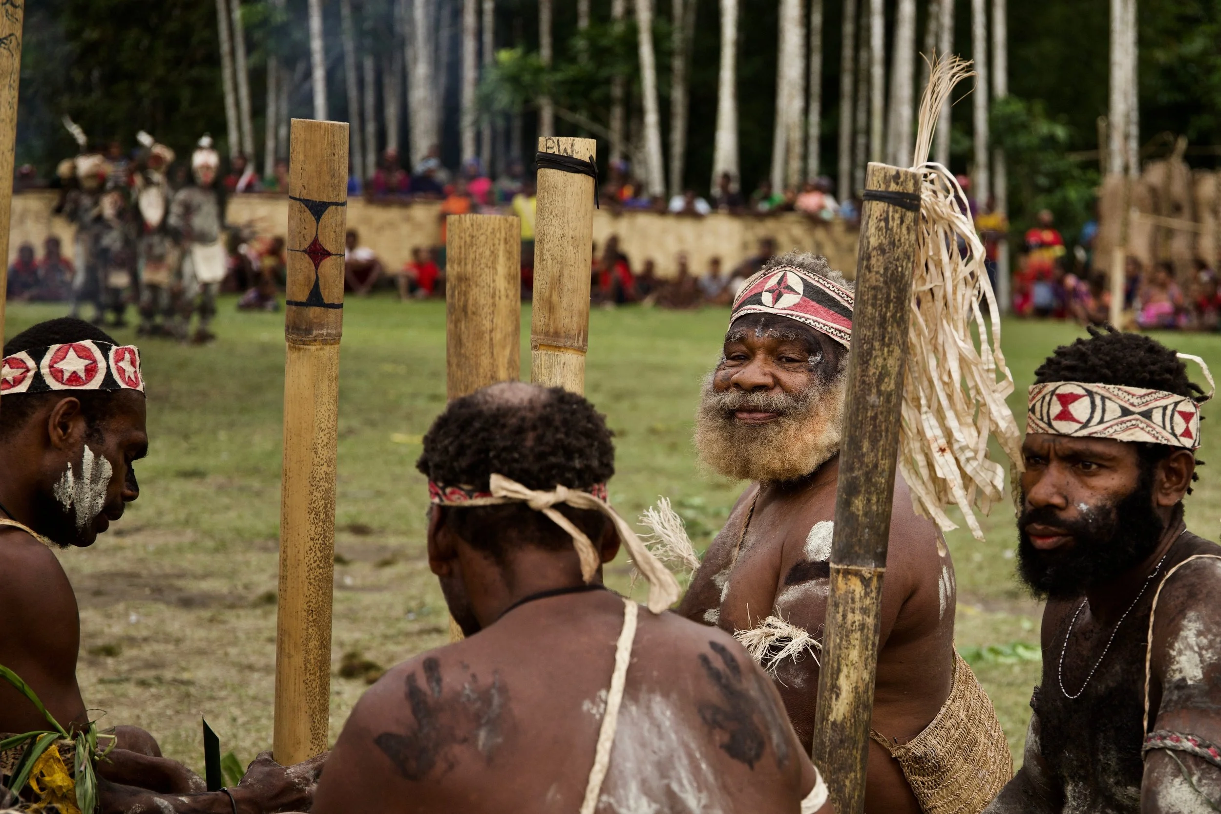 Portraits and candid moments of Papua New Guinea’s diverse cultures, featuring traditional dress, masks, and ceremonial performances.