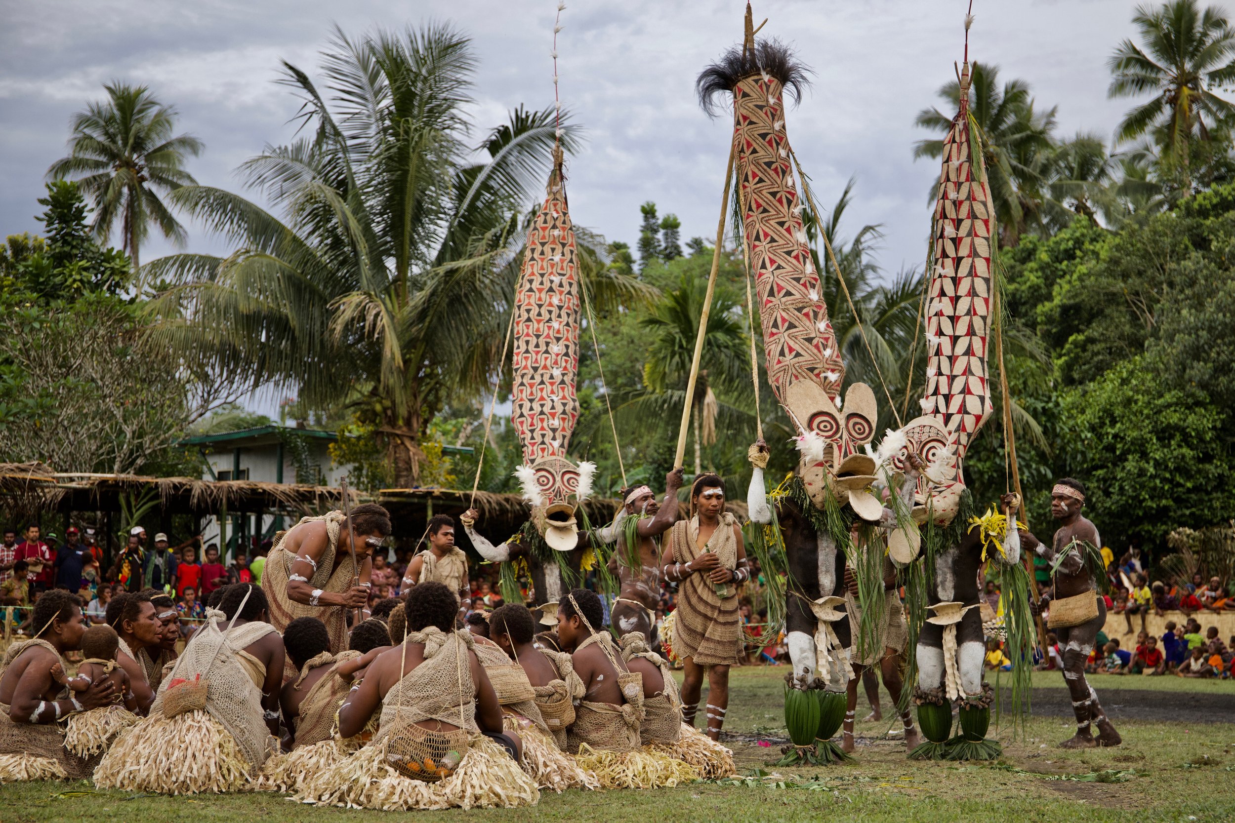Portraits and candid moments of Papua New Guinea’s diverse cultures, featuring traditional dress, masks, and ceremonial performances.