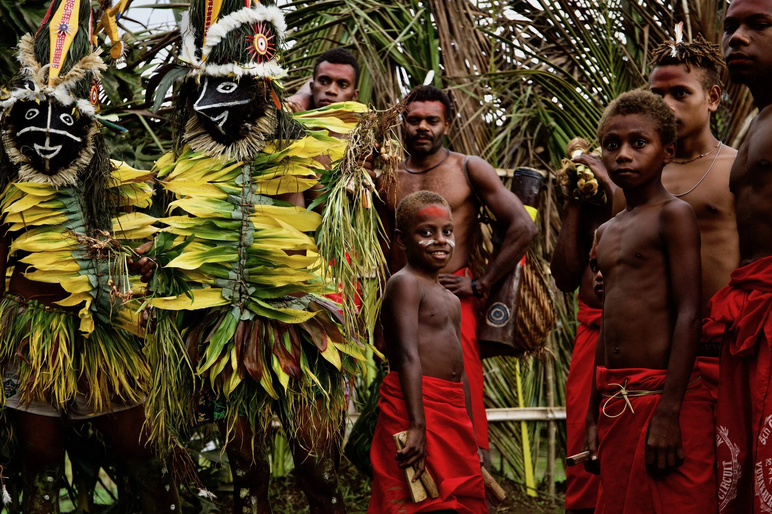 Portraits and candid moments of Papua New Guinea’s diverse cultures, featuring traditional dress, masks, and ceremonial performances.