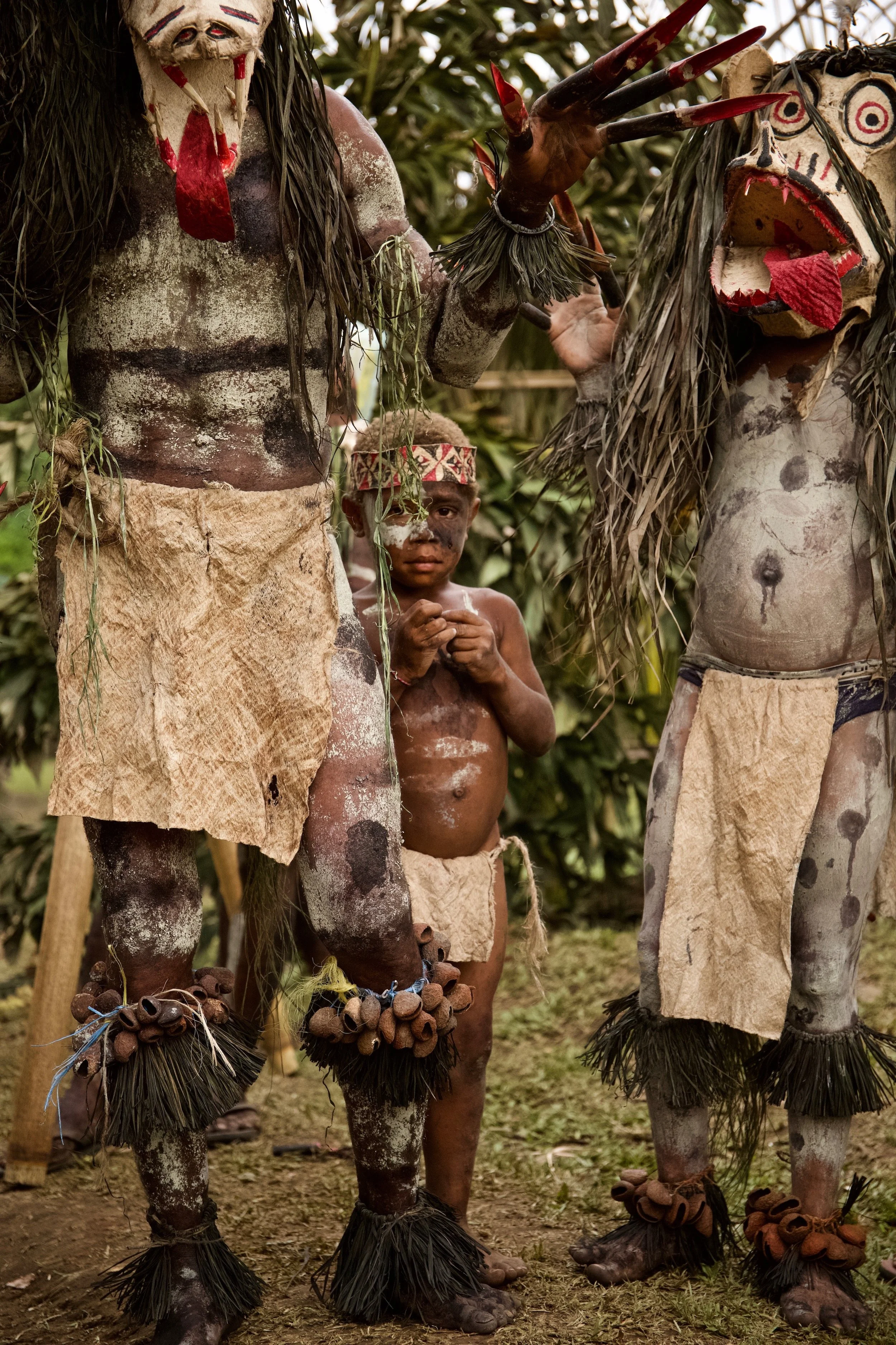 Portraits and candid moments of Papua New Guinea’s diverse cultures, featuring traditional dress, masks, and ceremonial performances.