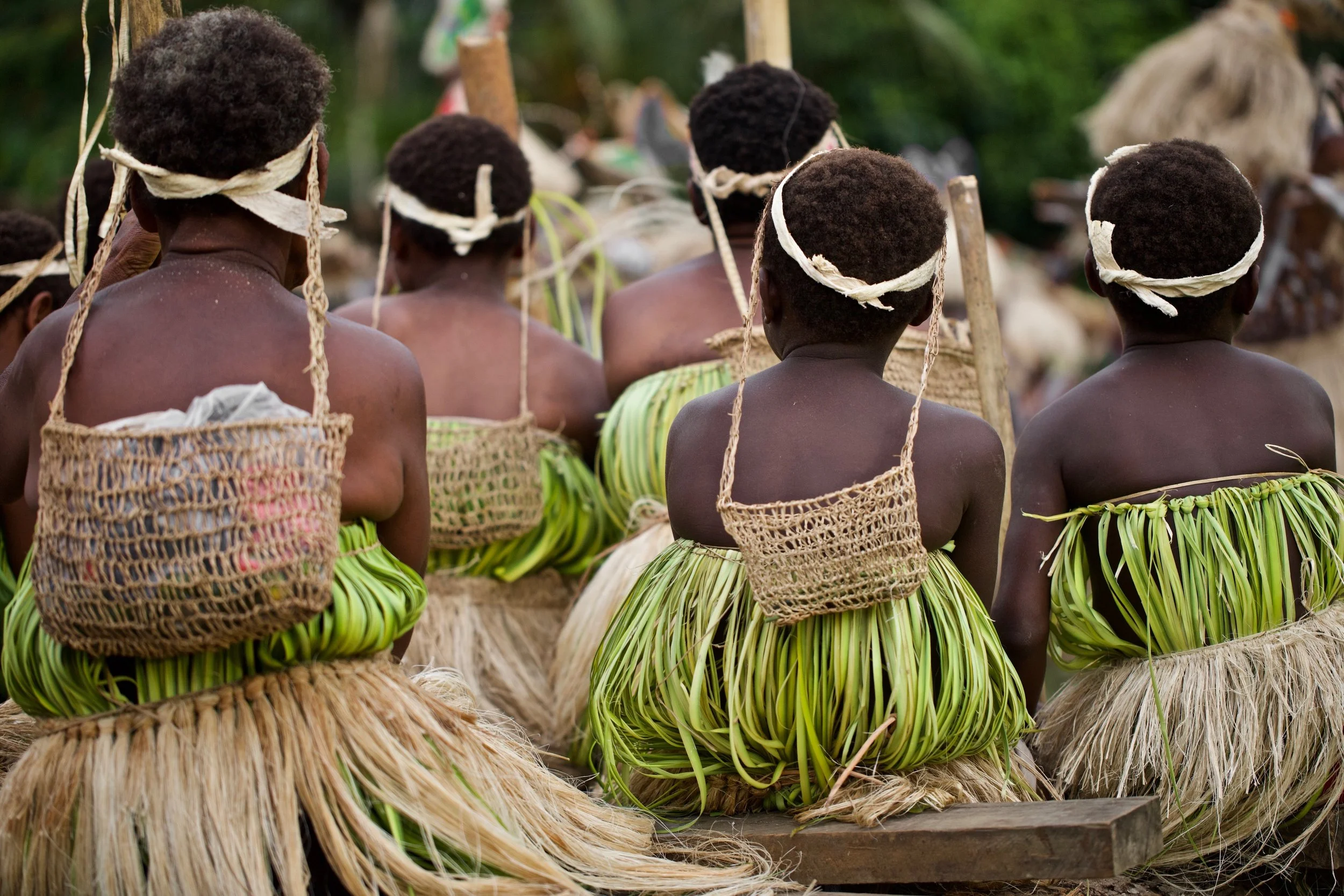 Portraits and candid moments of Papua New Guinea’s diverse cultures, featuring traditional dress, masks, and ceremonial performances.