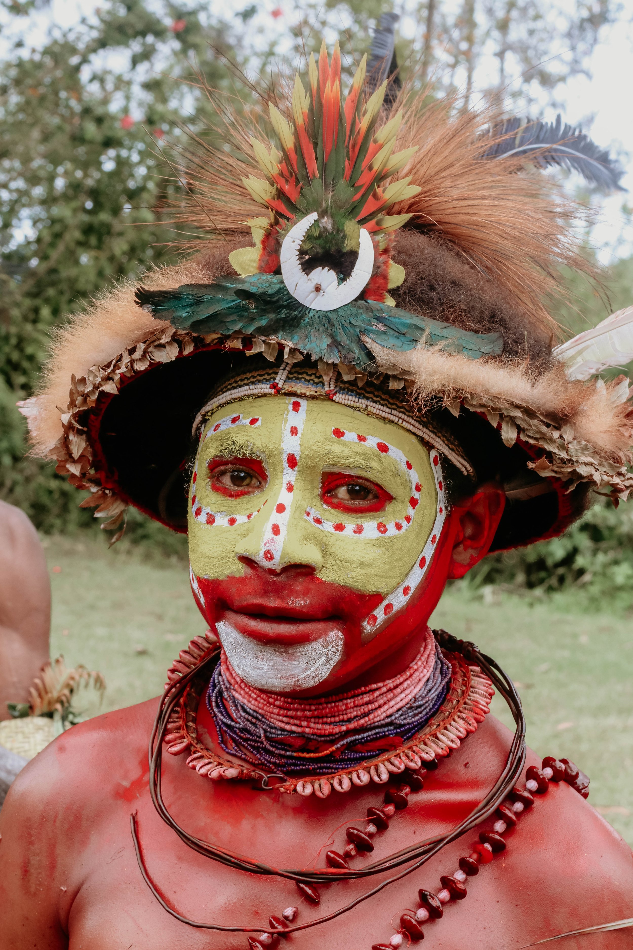 Portraits and candid moments of Papua New Guinea’s diverse cultures, featuring traditional dress, masks, and ceremonial performances.
