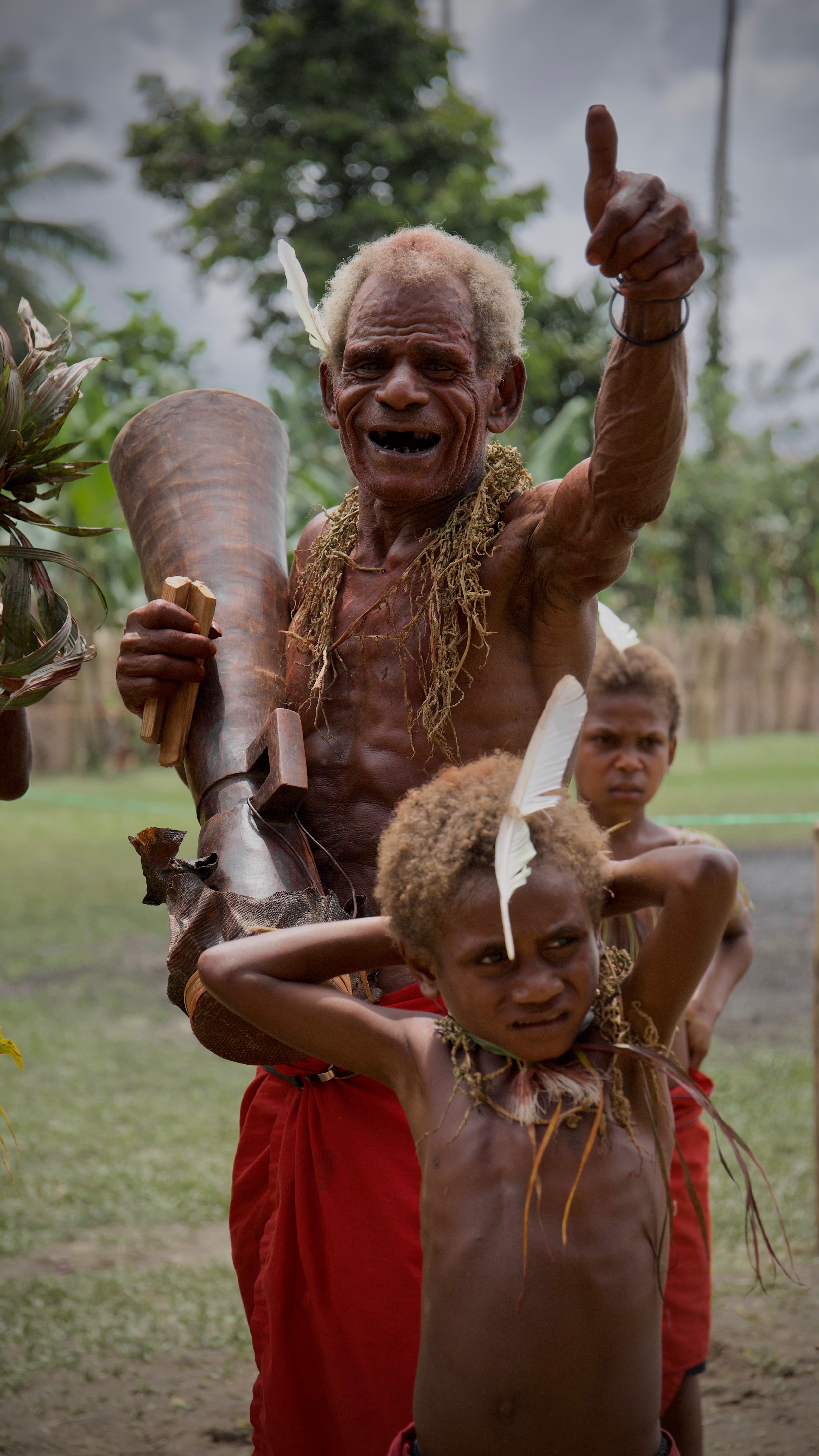 Portraits and candid moments of Papua New Guinea’s diverse cultures, featuring traditional dress, masks, and ceremonial performances.