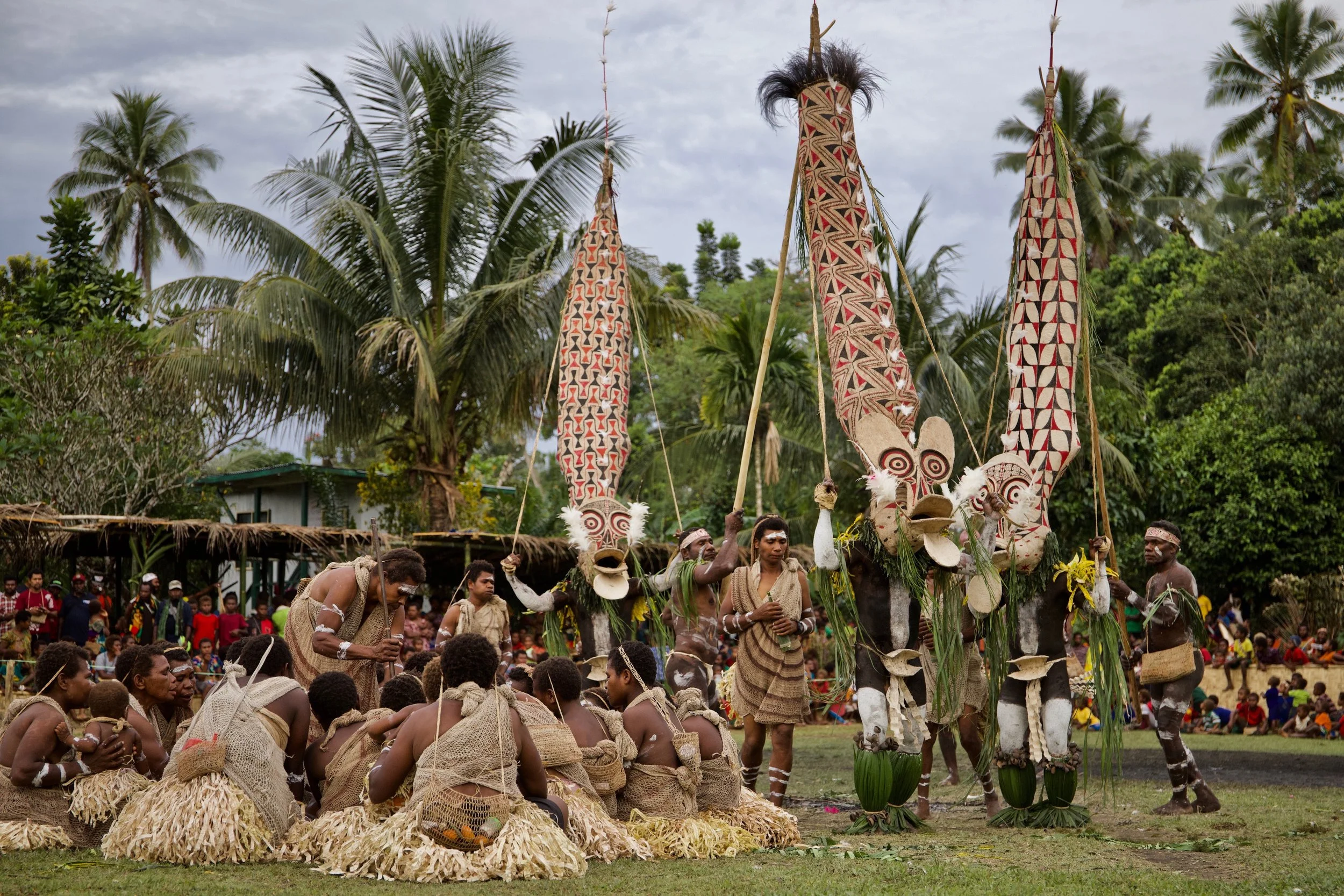 Portraits and candid moments of Papua New Guinea’s diverse cultures, featuring traditional dress, masks, and ceremonial performances.