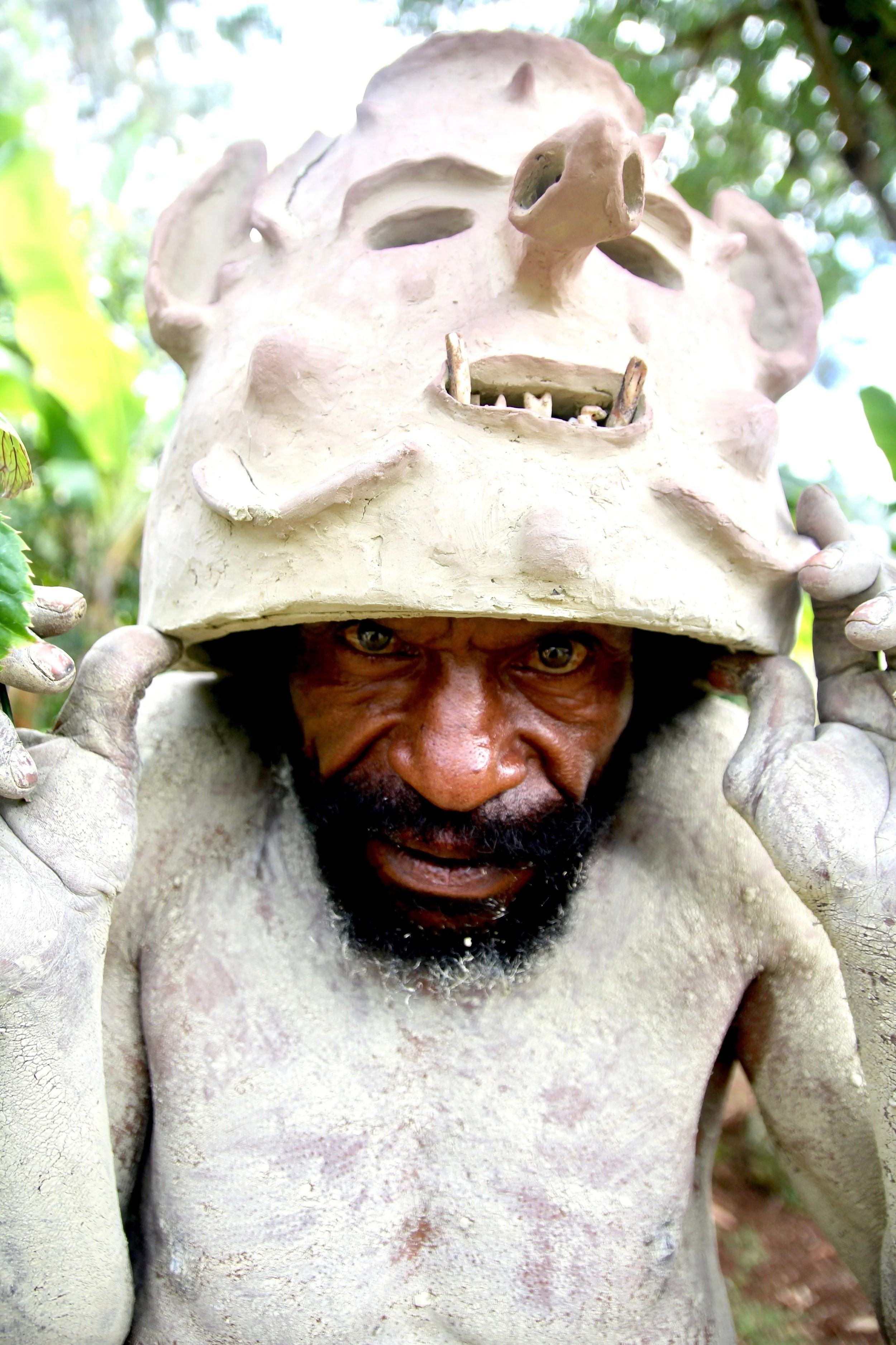 Portraits and candid moments of Papua New Guinea’s diverse cultures, featuring traditional dress, masks, and ceremonial performances.