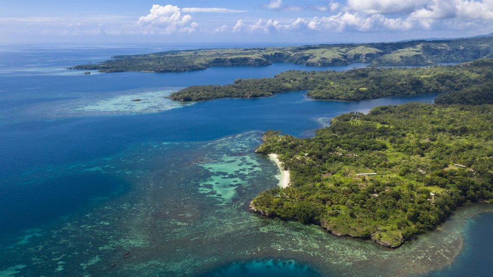 Scenic views from across Papua New Guinea, capturing tropical coastlines, lush landscapes, and tranquil waters.