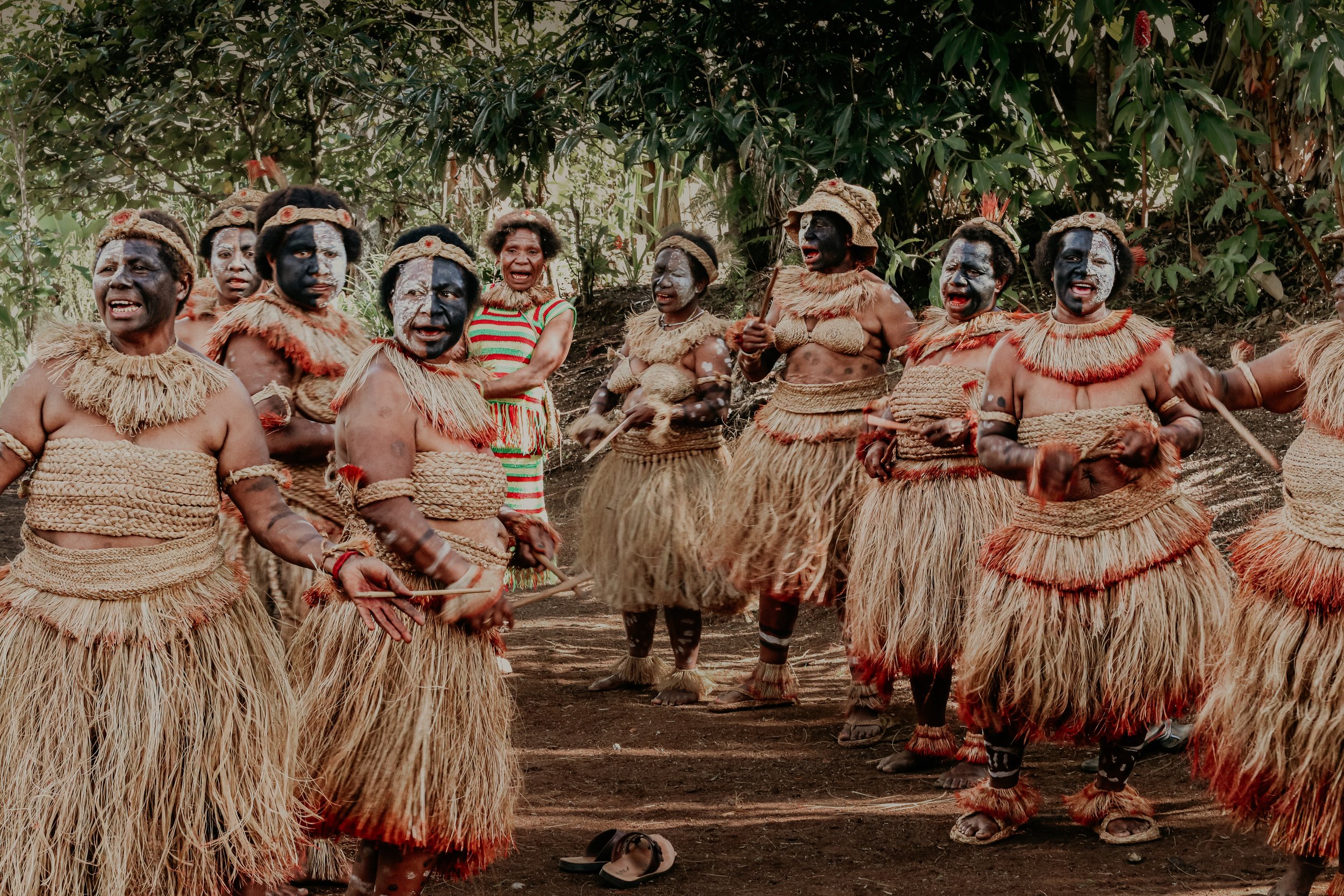 Portraits and candid moments of Papua New Guinea’s diverse cultures, featuring traditional dress, masks, and ceremonial performances.