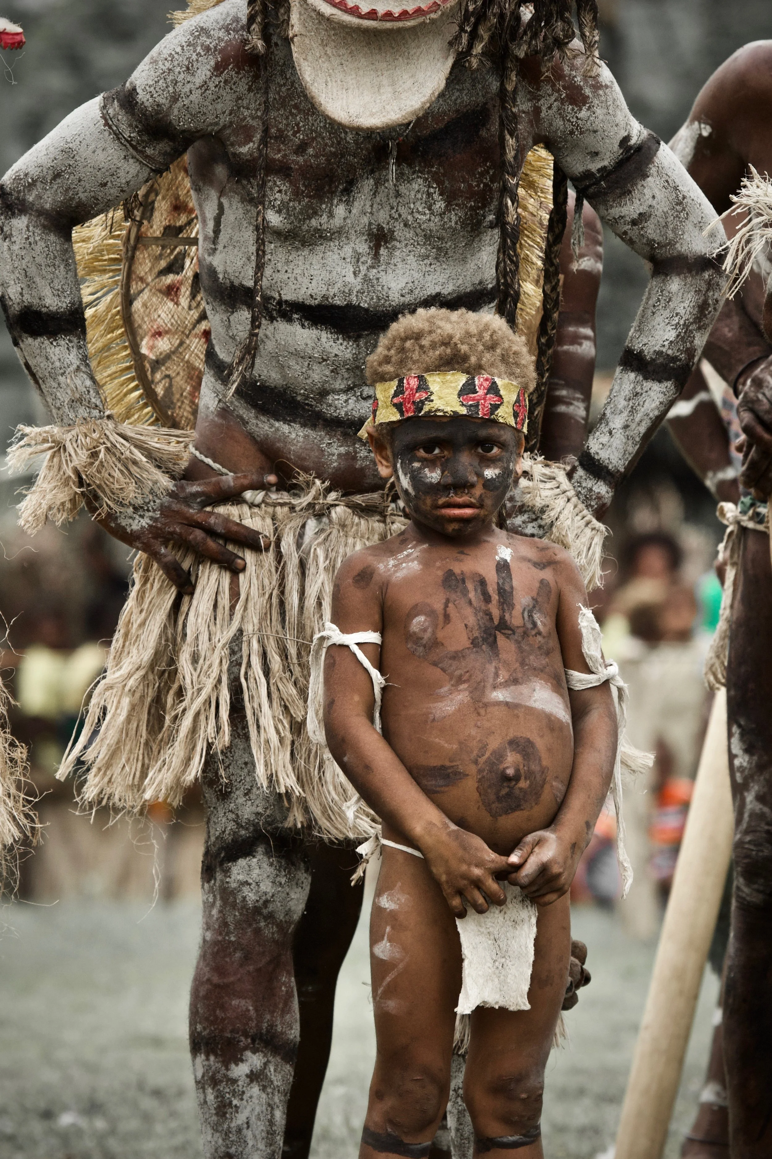 Portraits and candid moments of Papua New Guinea’s diverse cultures, featuring traditional dress, masks, and ceremonial performances.