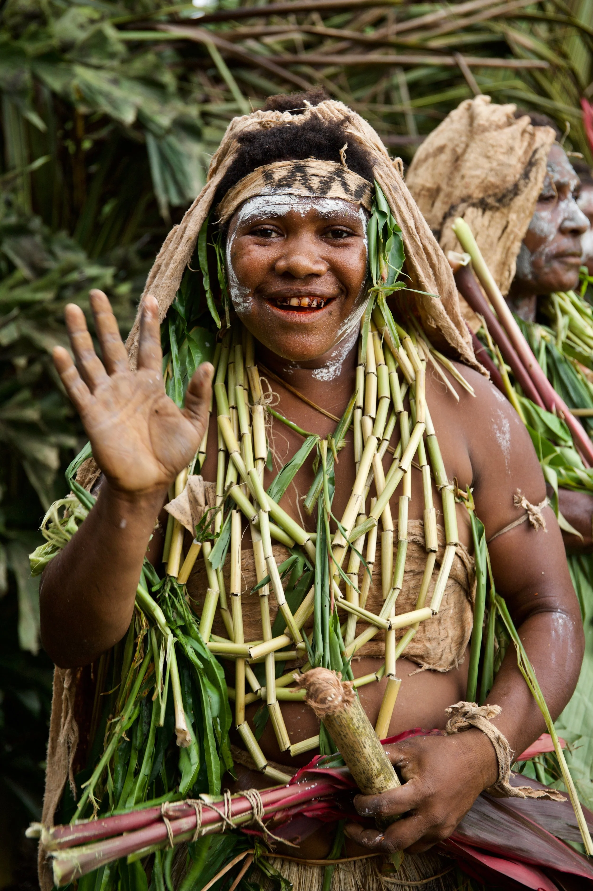 Portraits and candid moments of Papua New Guinea’s diverse cultures, featuring traditional dress, masks, and ceremonial performances.
