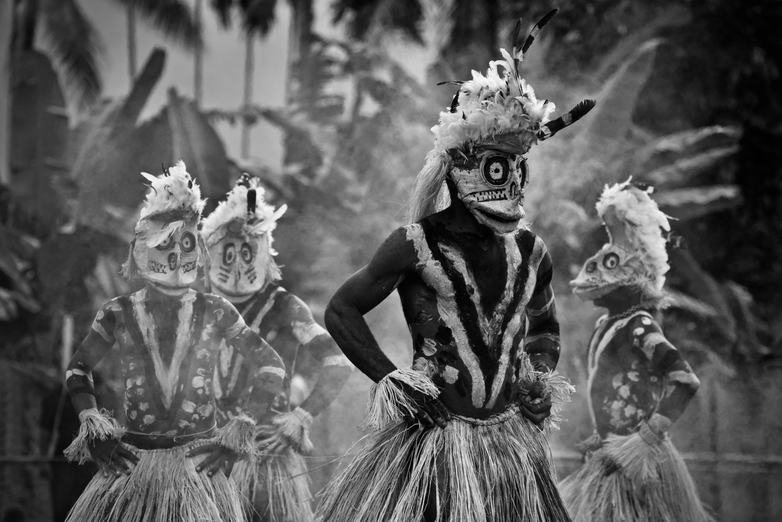 Portraits and candid moments of Papua New Guinea’s diverse cultures, featuring traditional dress, masks, and ceremonial performances.