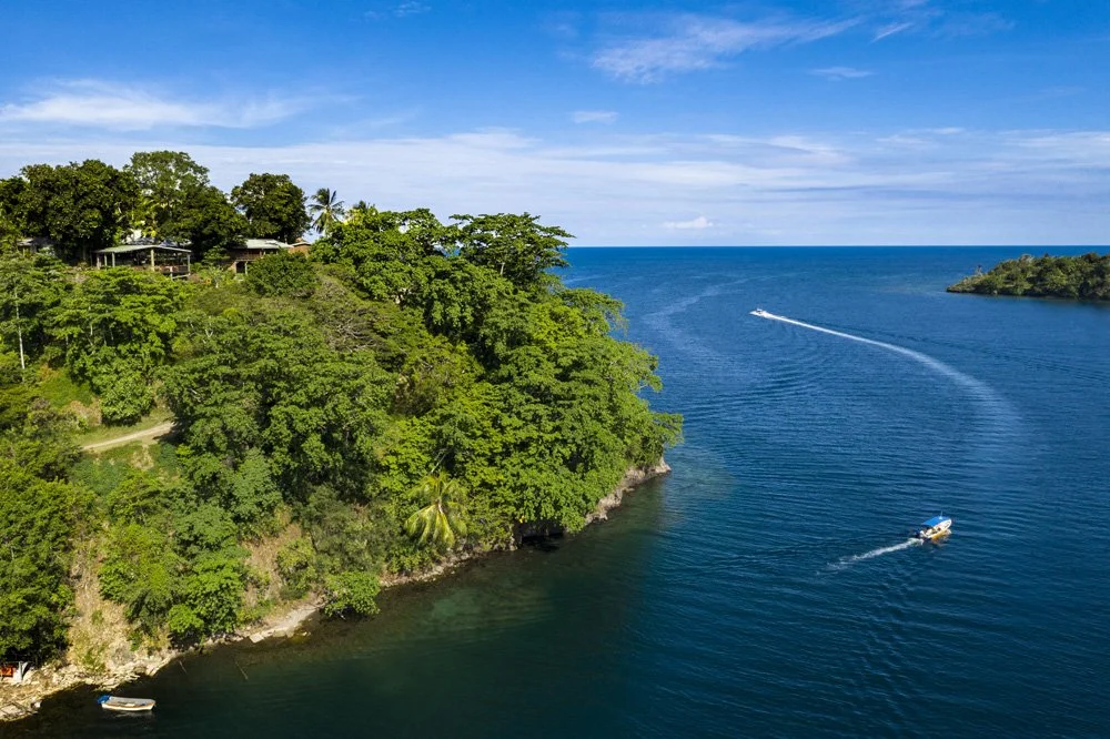 Scenic views from across Papua New Guinea, capturing tropical coastlines, lush landscapes, and tranquil waters.