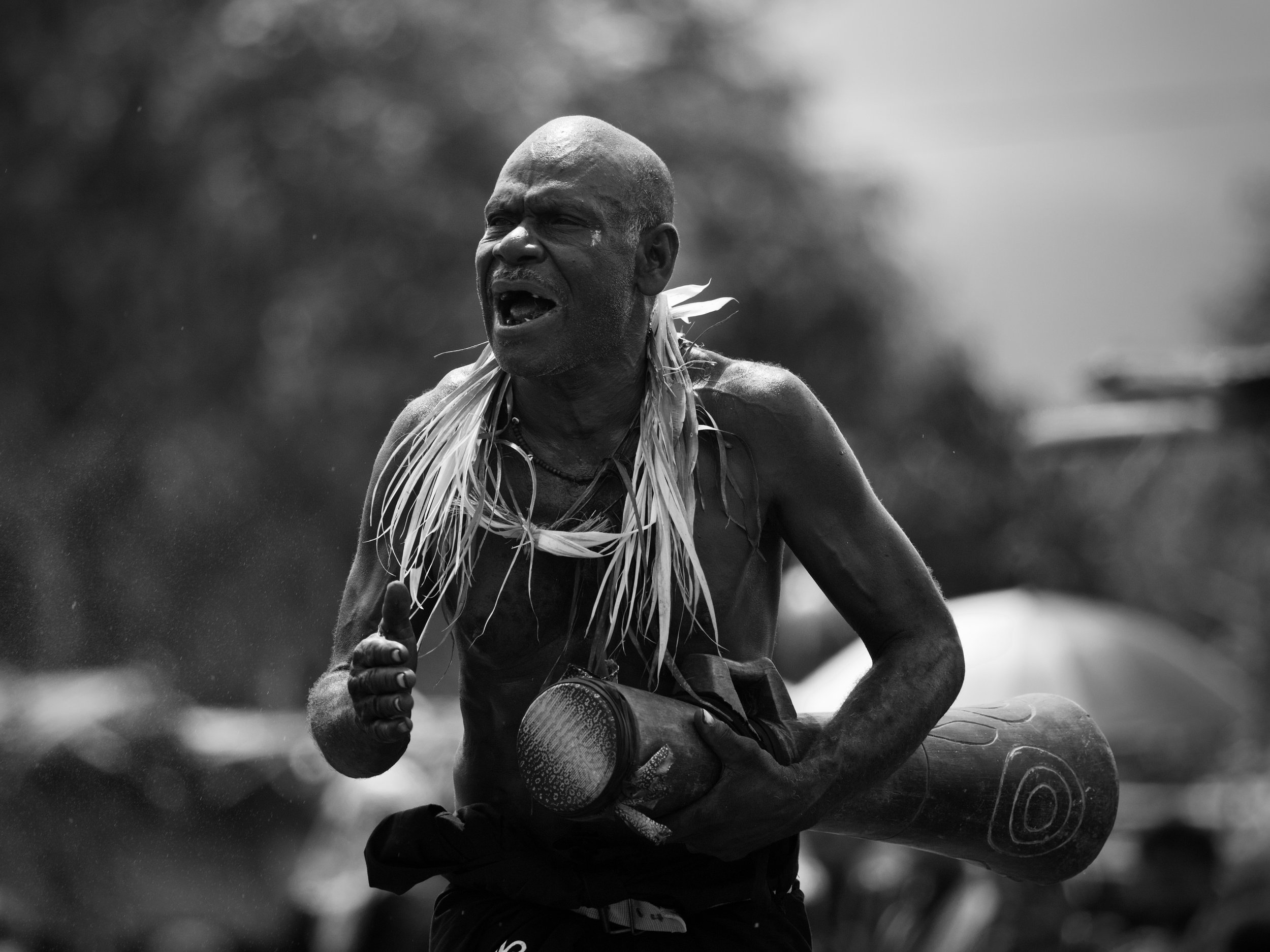 Portraits and candid moments of Papua New Guinea’s diverse cultures, featuring traditional dress, masks, and ceremonial performances.