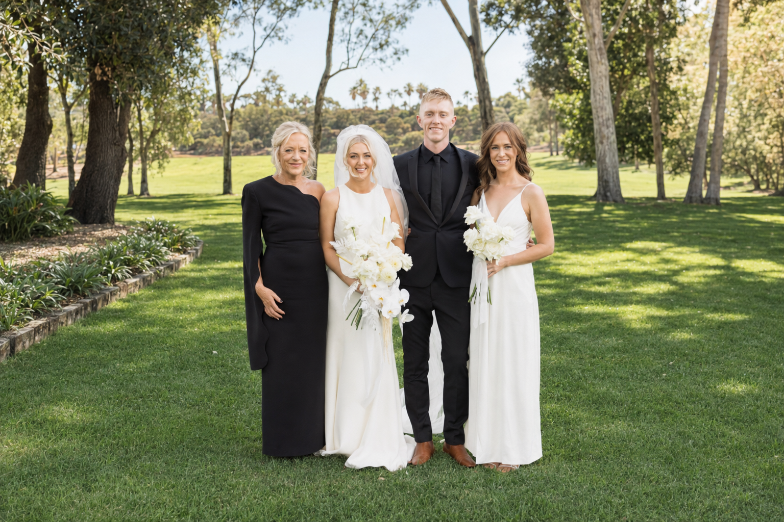 Amy, Morgan, Alison and Chloe Tornow Celebrant celebrating together in the gardens at Greenfield Acres Riverland wedding venue.