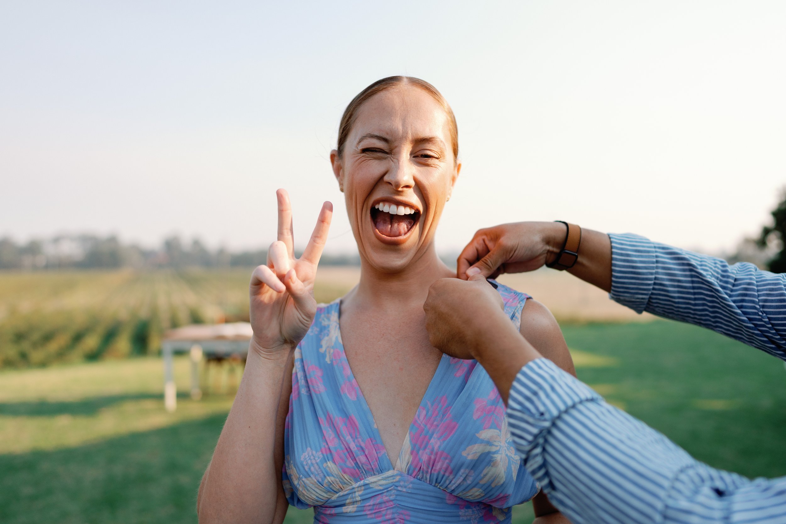 Chloe Tornow Celebrant smiling in the gardens at Greenfield Acres Riverland wedding venue.