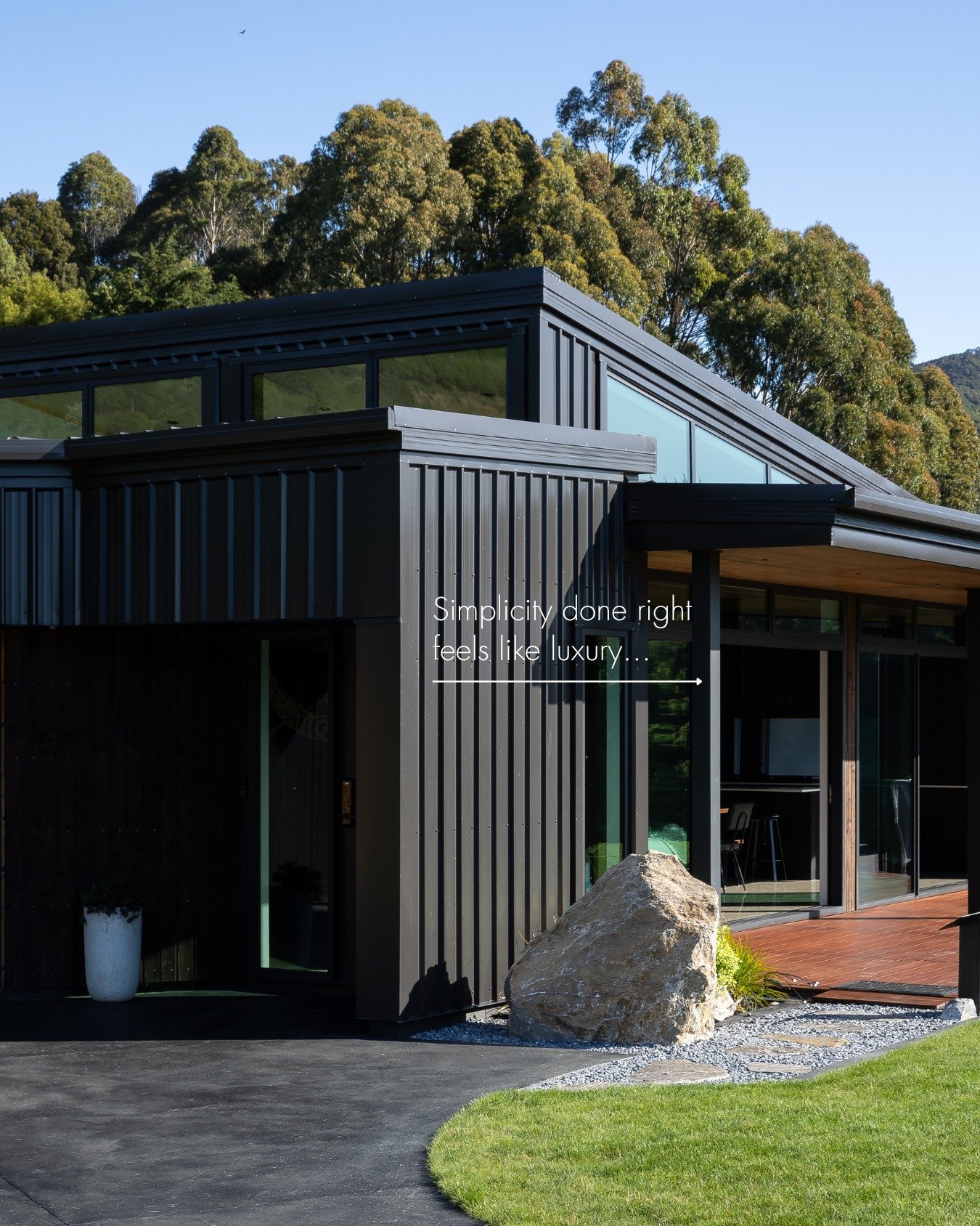 This home doesn&rsquo;t compete with its surroundings, it becomes part of them.

The sharp black cladding, warm timber tones, and expansive glazing are all about balance: bold yet grounded, private yet open to the landscape.

It&rsquo;s a reminder th