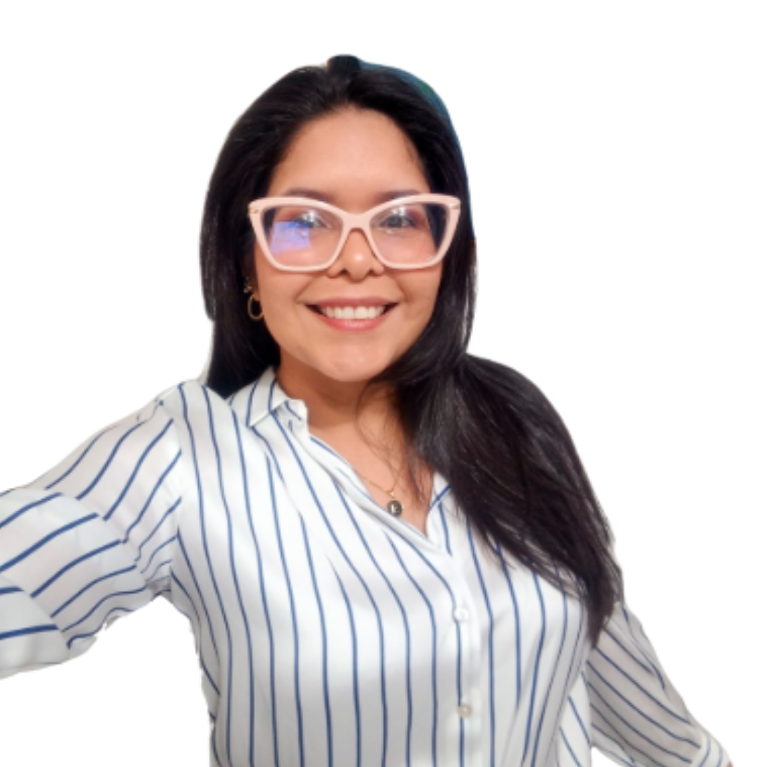 A woman with dark hair, wearing large pink glasses and a white and blue striped shirt, smiling at the camera.