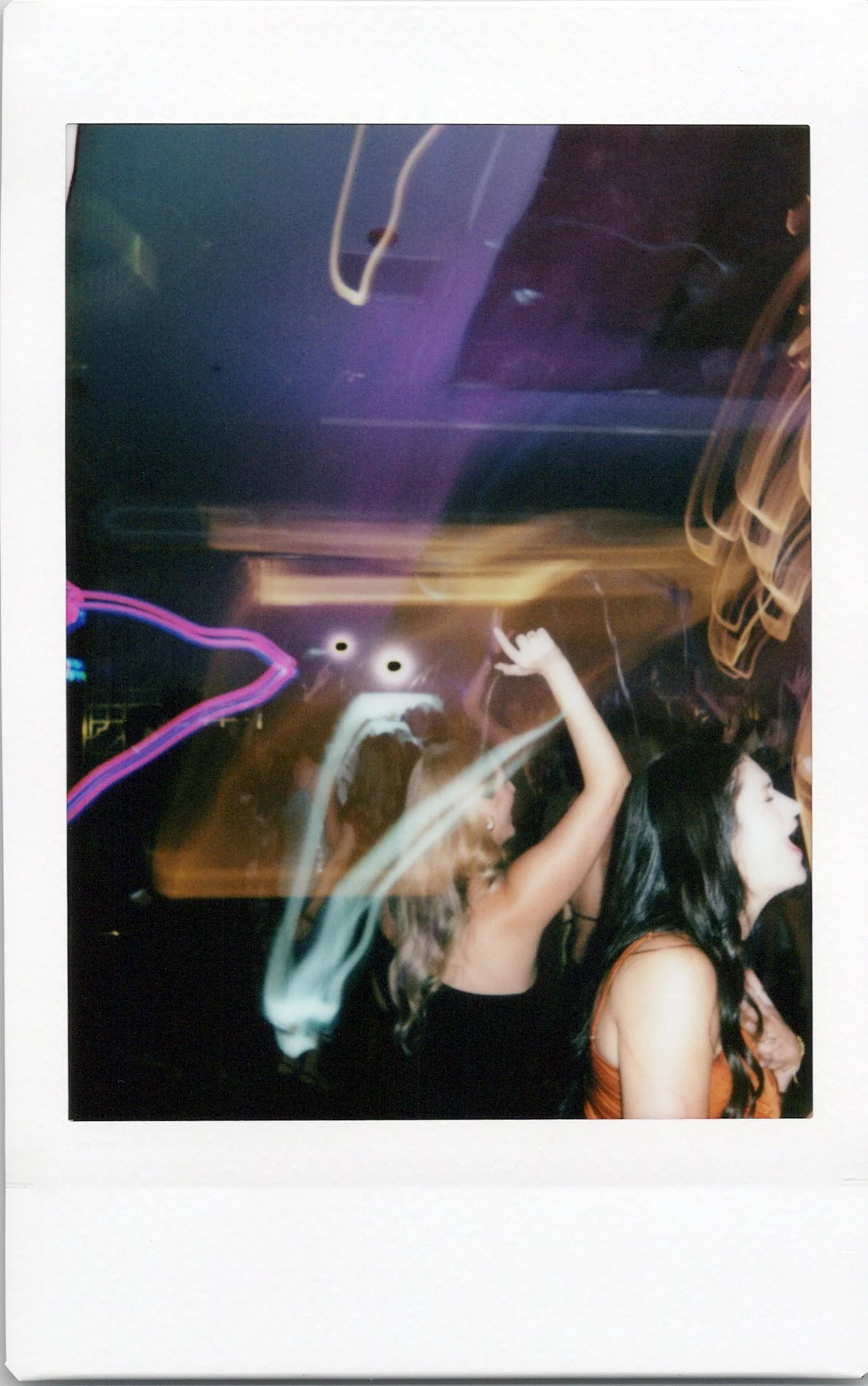 People dancing at a Chicago wedding at LM Studios in an Instax Mini photo.