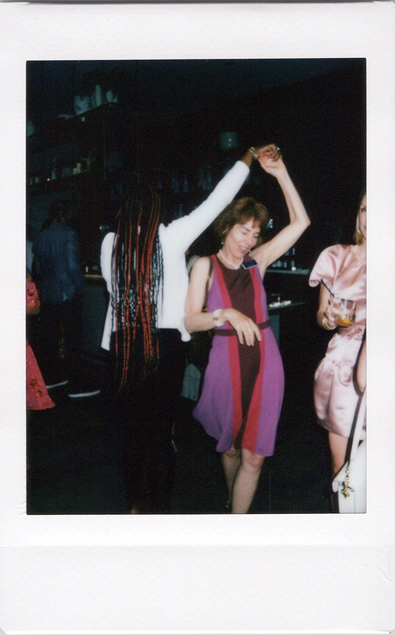 Guests dancing at a chicago event on instax mini film