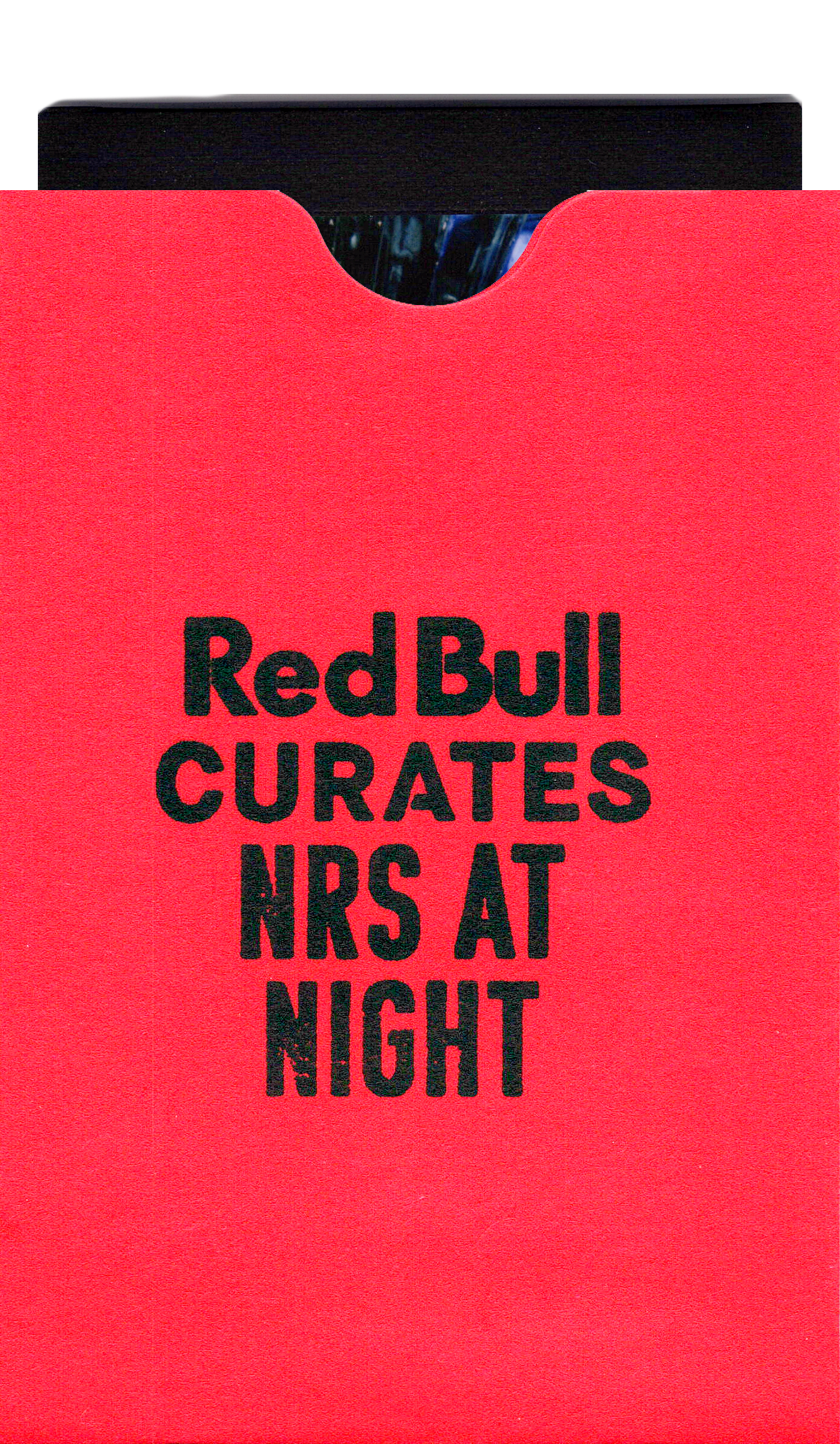 Custom branded red Instax mini photo sleeve stamped with "Red Bull CURATES NRS AT NIGHT" in black