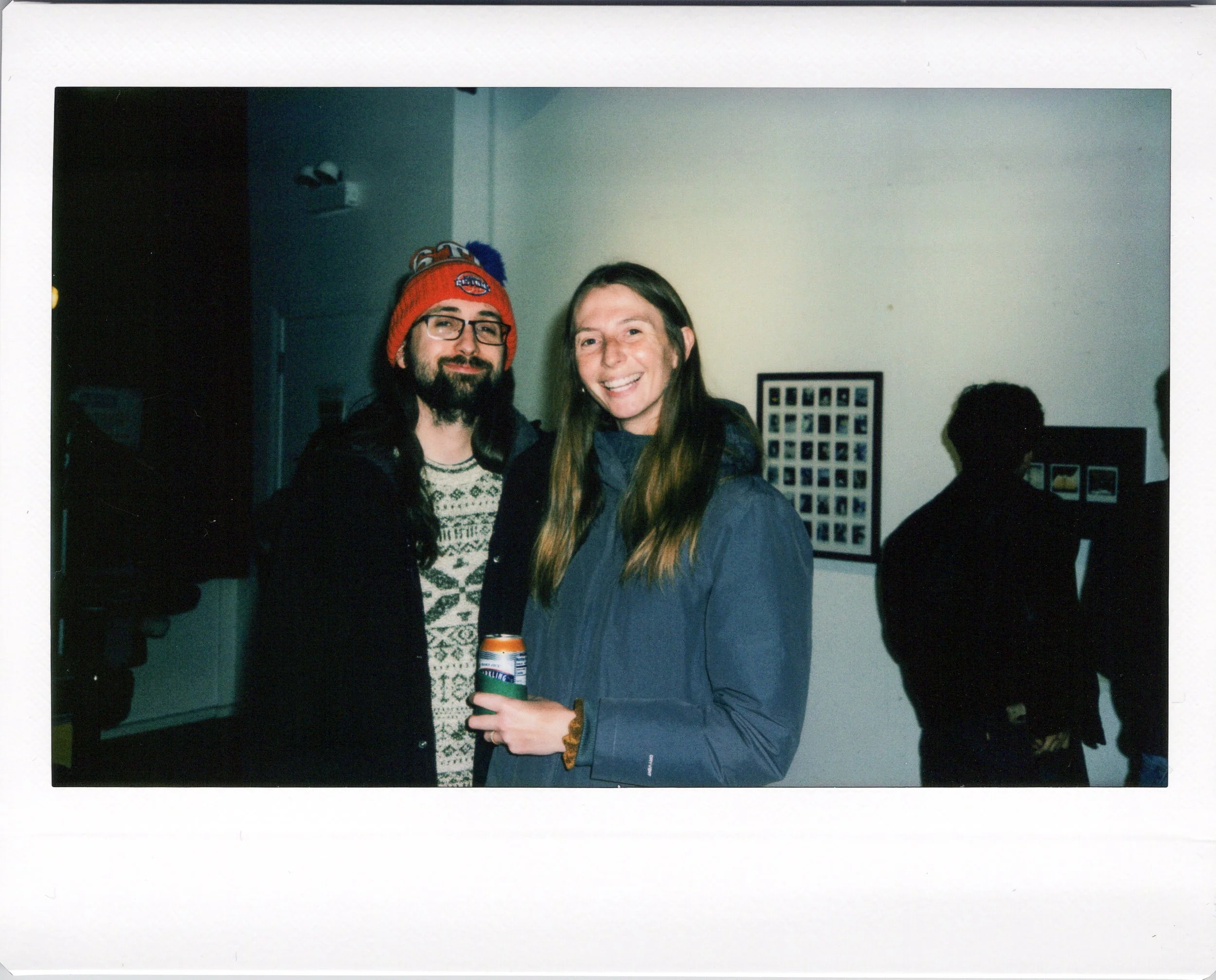 Instax wide photo of a midwest couple posing at an art event in chicago