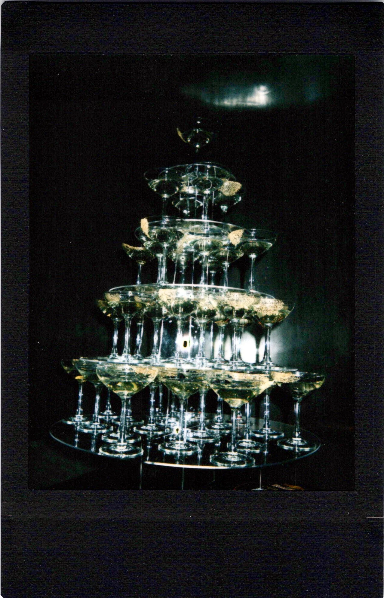 an instant photo of a Champagne tower at a Red Bull brand activation in Chicago