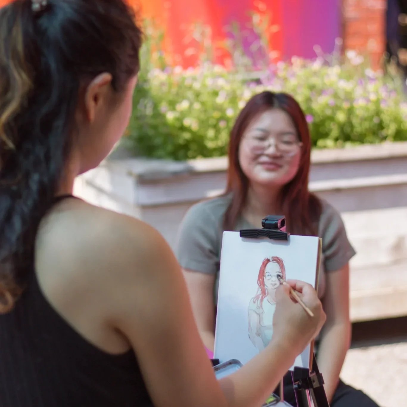 a live portrait artist painting a guest at a chicago event