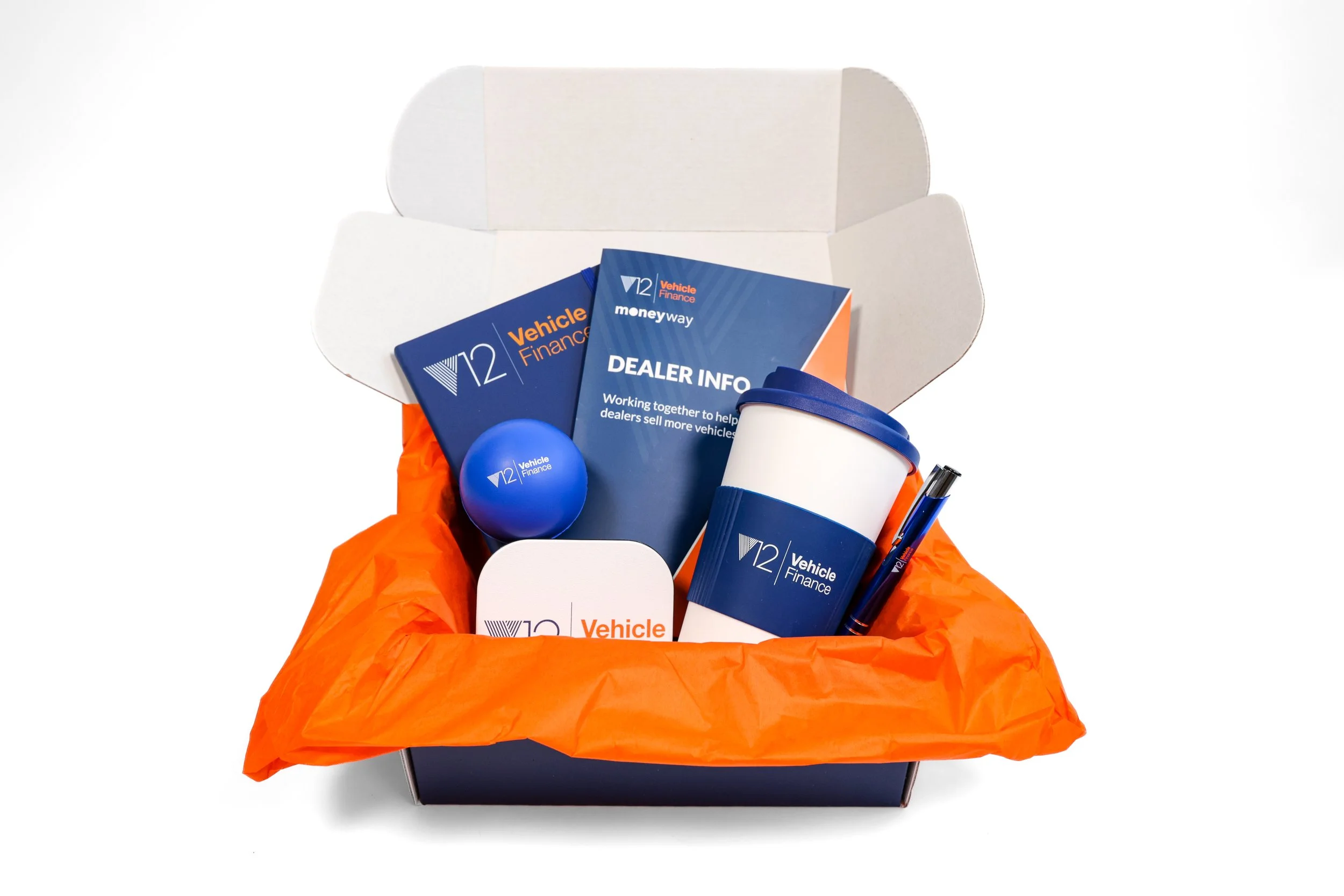 example of a new customer welcome box with merch and print collateral