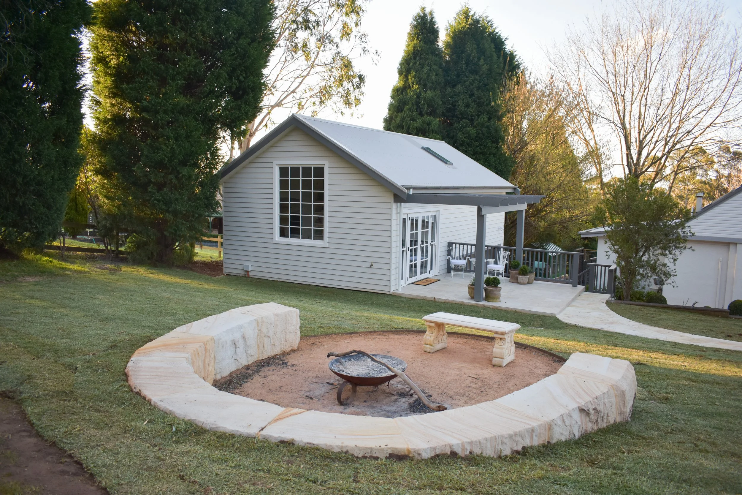 The fire pit and landscaping done on the Oxley Drive Renovation