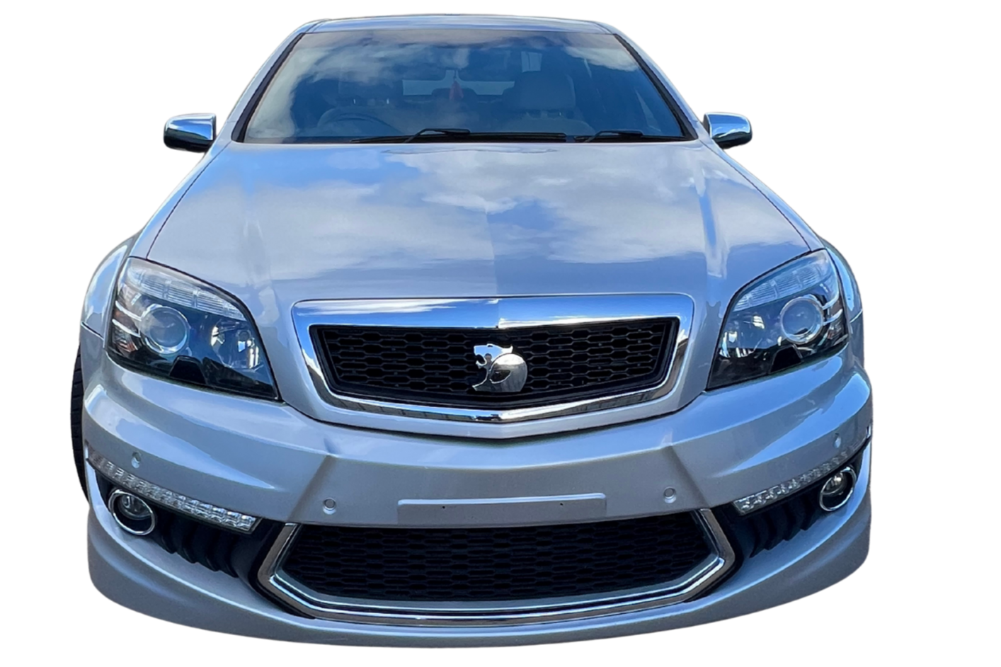 Front view of a silver car, showing the grille, headlights, and bumper.