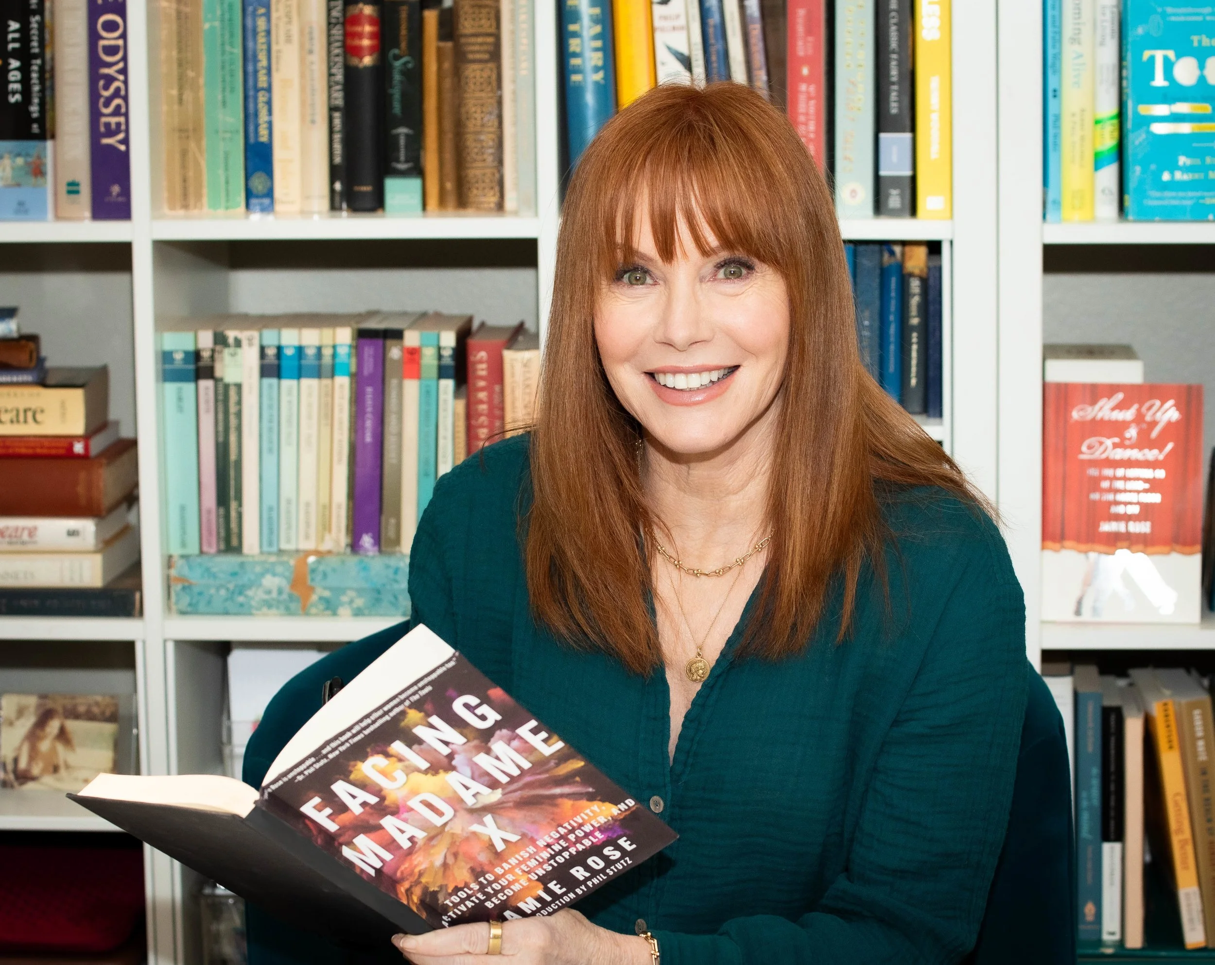 Photo of Jamie Rose holding her book Facing Madame X