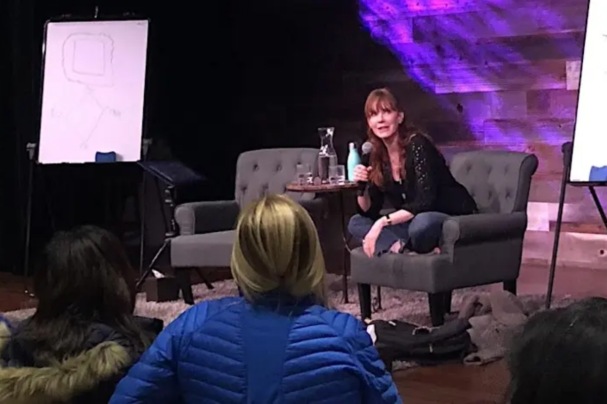 Photo showing Jamie Rose speaking to a group