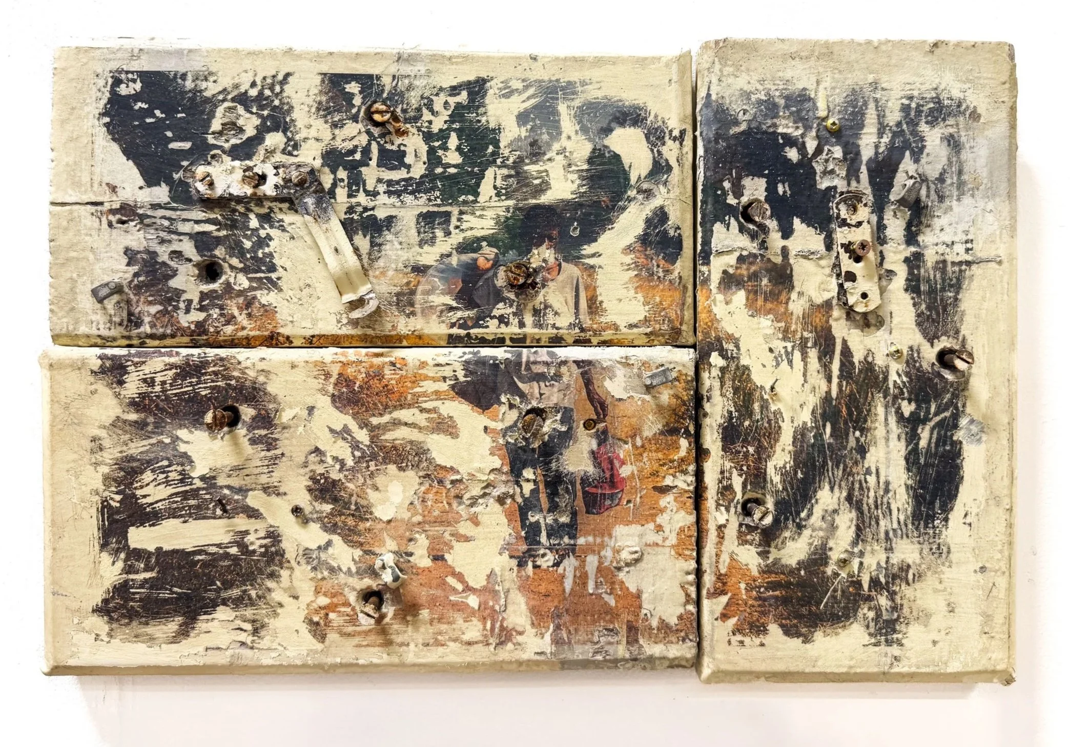 Weathered and scratched wooden panels with multiple rusty screws, and remnants of a faded image of a person.