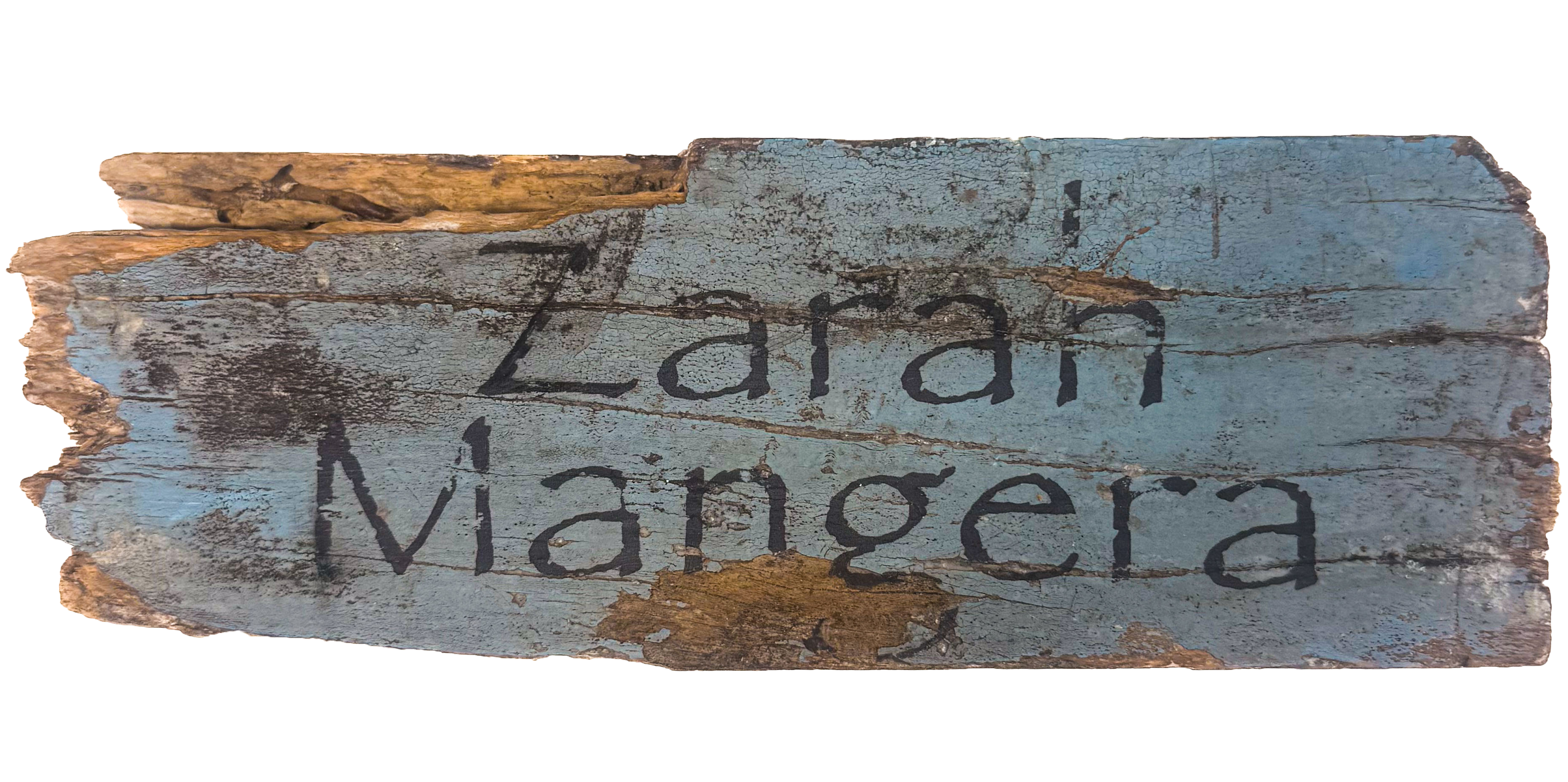A weathered teak wood panel with chipped blue paint, bearing the word 'Zarah Mangera' in black lettering.