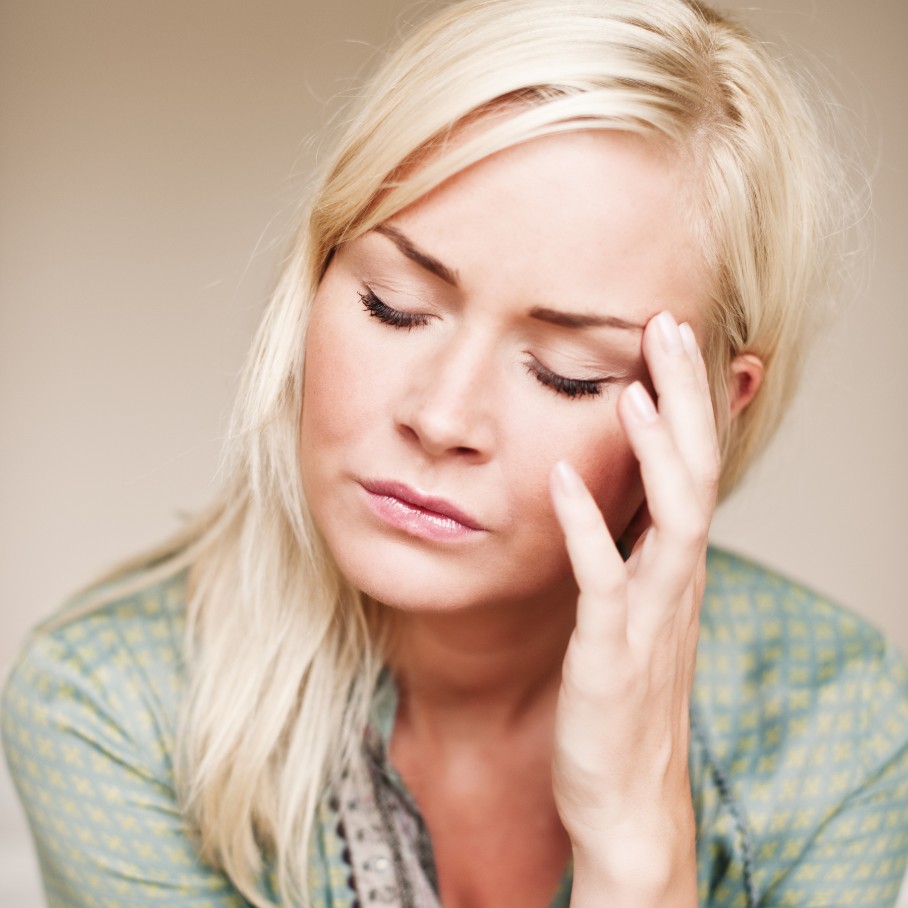 Tired and confused woman in perimenopause or menopause