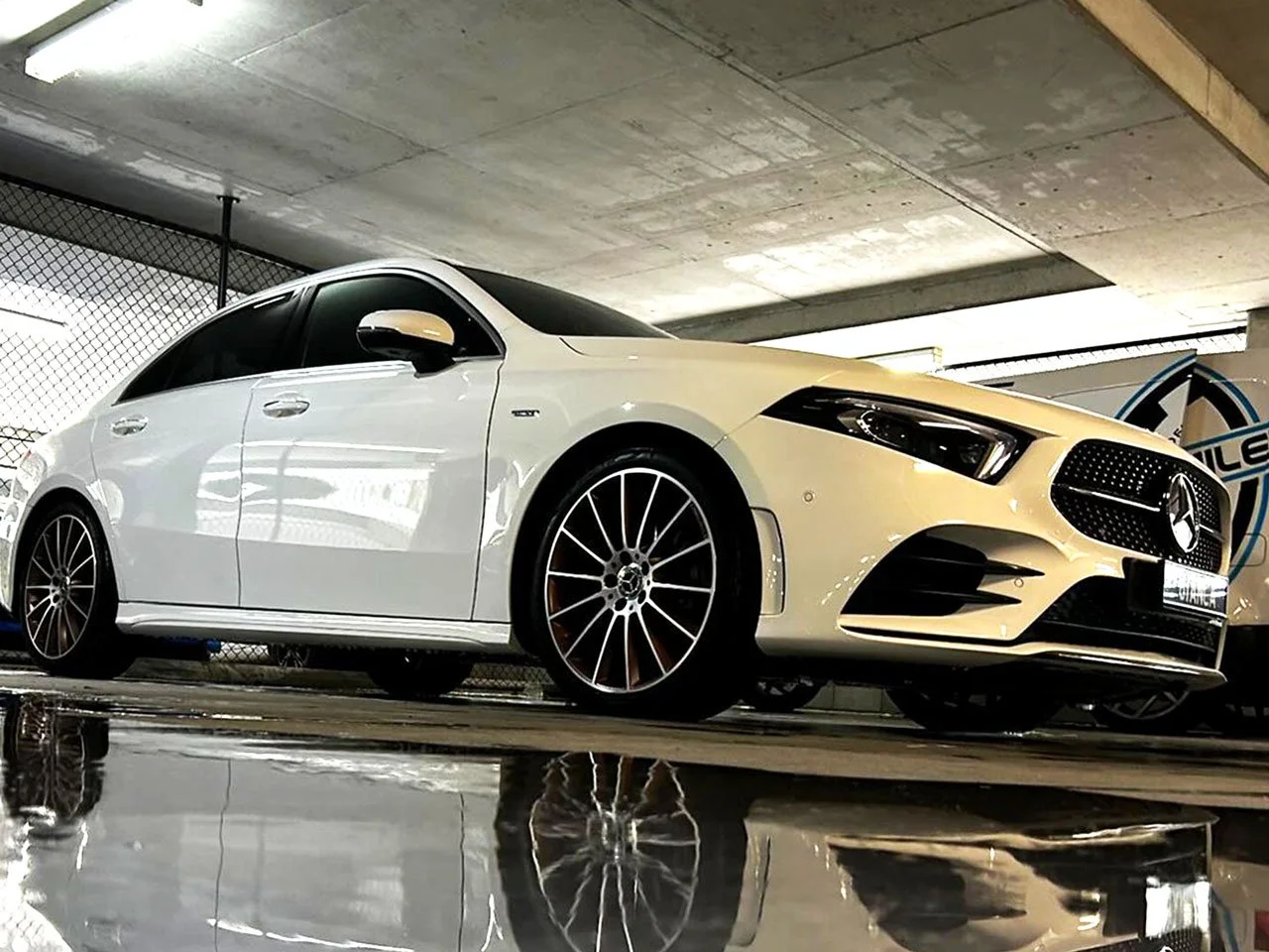 A white Mercedes sedan newly detailed by Dan the Detailer mobile detailing services.