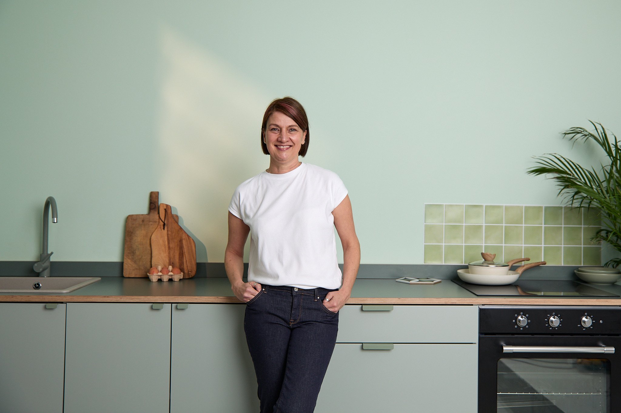 Caroline in a beautiful, minimal kitchen.