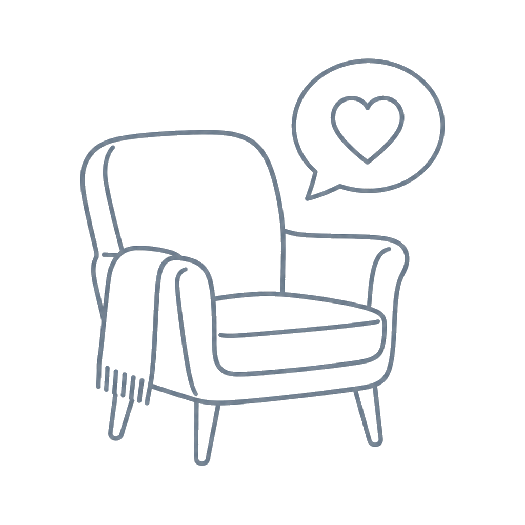 Line drawing of a cozy armchair with a blanket draped over one arm, and a speech bubble with a heart symbol, suggesting love or comfort.