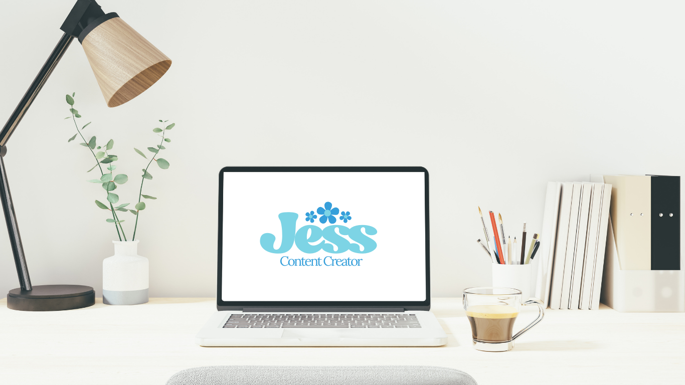 Minimalist workspace with a laptop displaying 'Jess Content Creator' logo, a glass of coffee, a white cup with writing utensils, a small white vase with greenery, and a stack of books on a white desk with a white wall background.