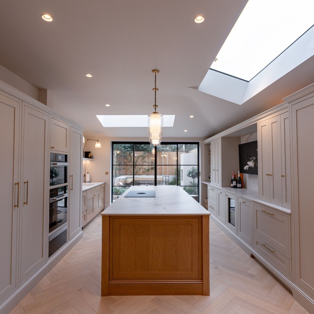 A bespoke kitchen designed and built by ParkerRose, featuring handmade cabinetry, a considered paint palette and natural work surfaces, photographed in a Cambridgeshire home