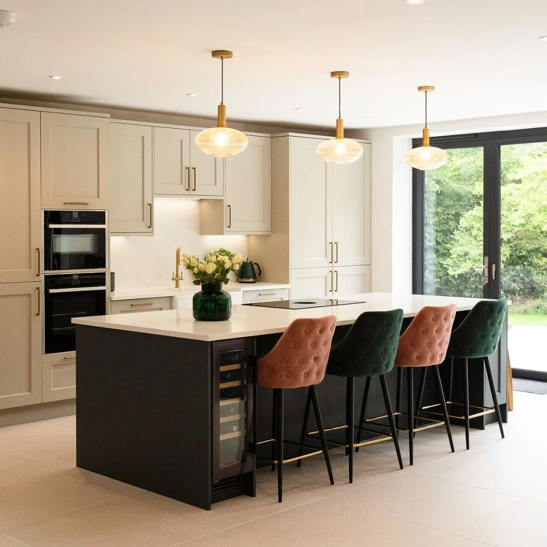 A beautifully finished bespoke kitchen interior showing a full run of handmade cabinetry, bespoke storage solutions and a work surface chosen to complement the overall design